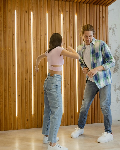 Two People Play Fighting Indoors