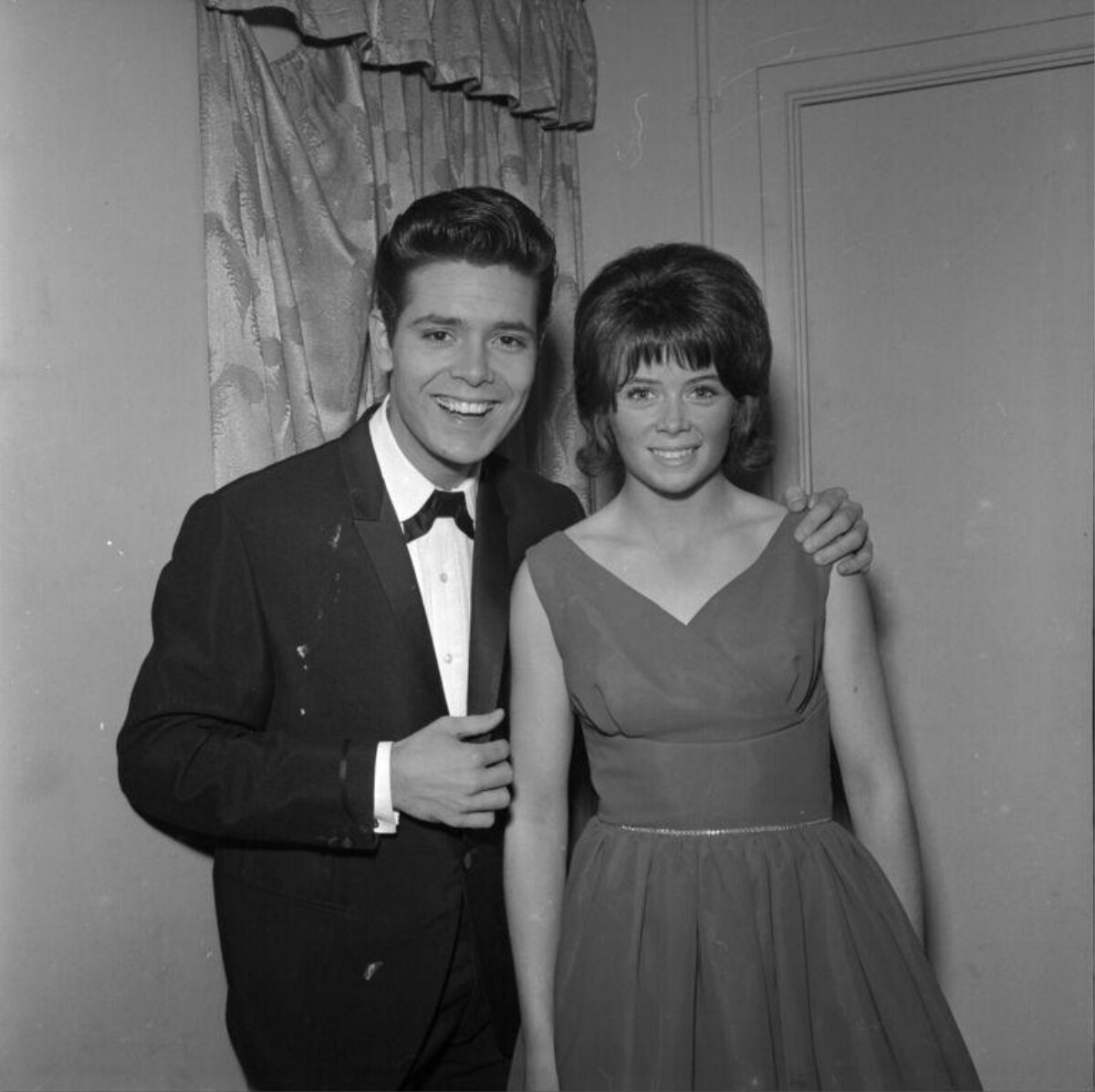 Formal 1960s Portrait of Smiling Couple