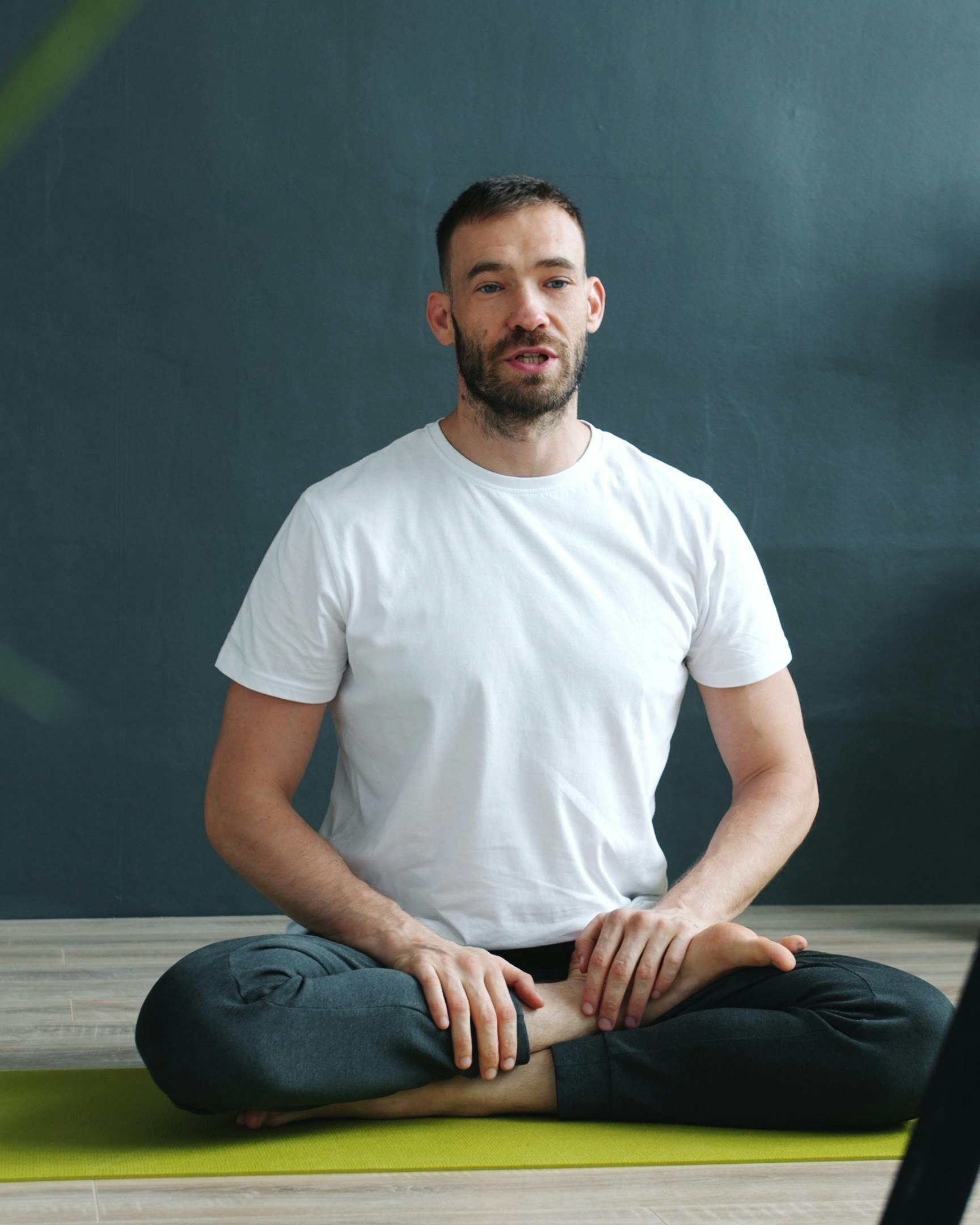 Man Practicing Yoga Indoors