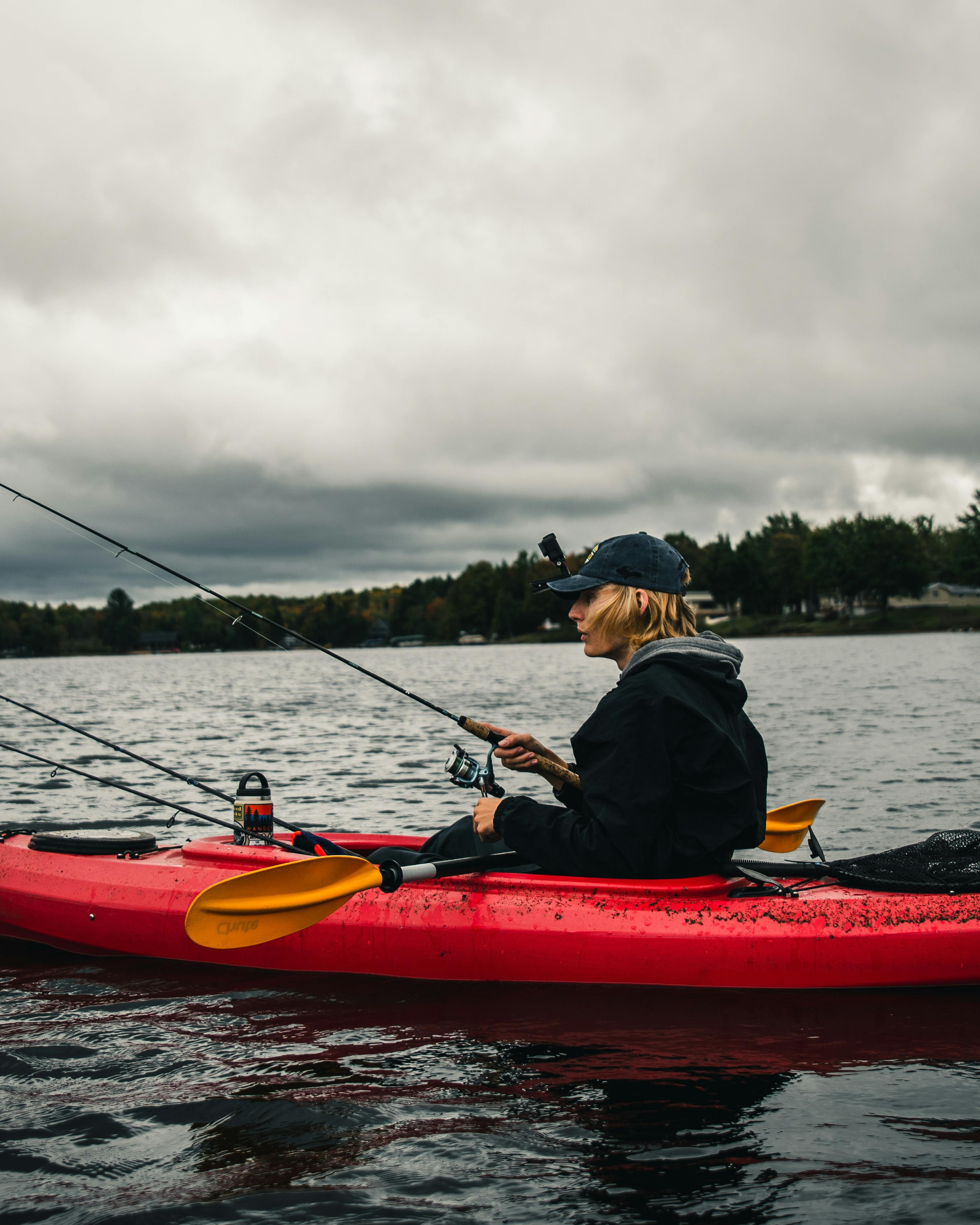 Kayak Fishing on a Cloudy Lake