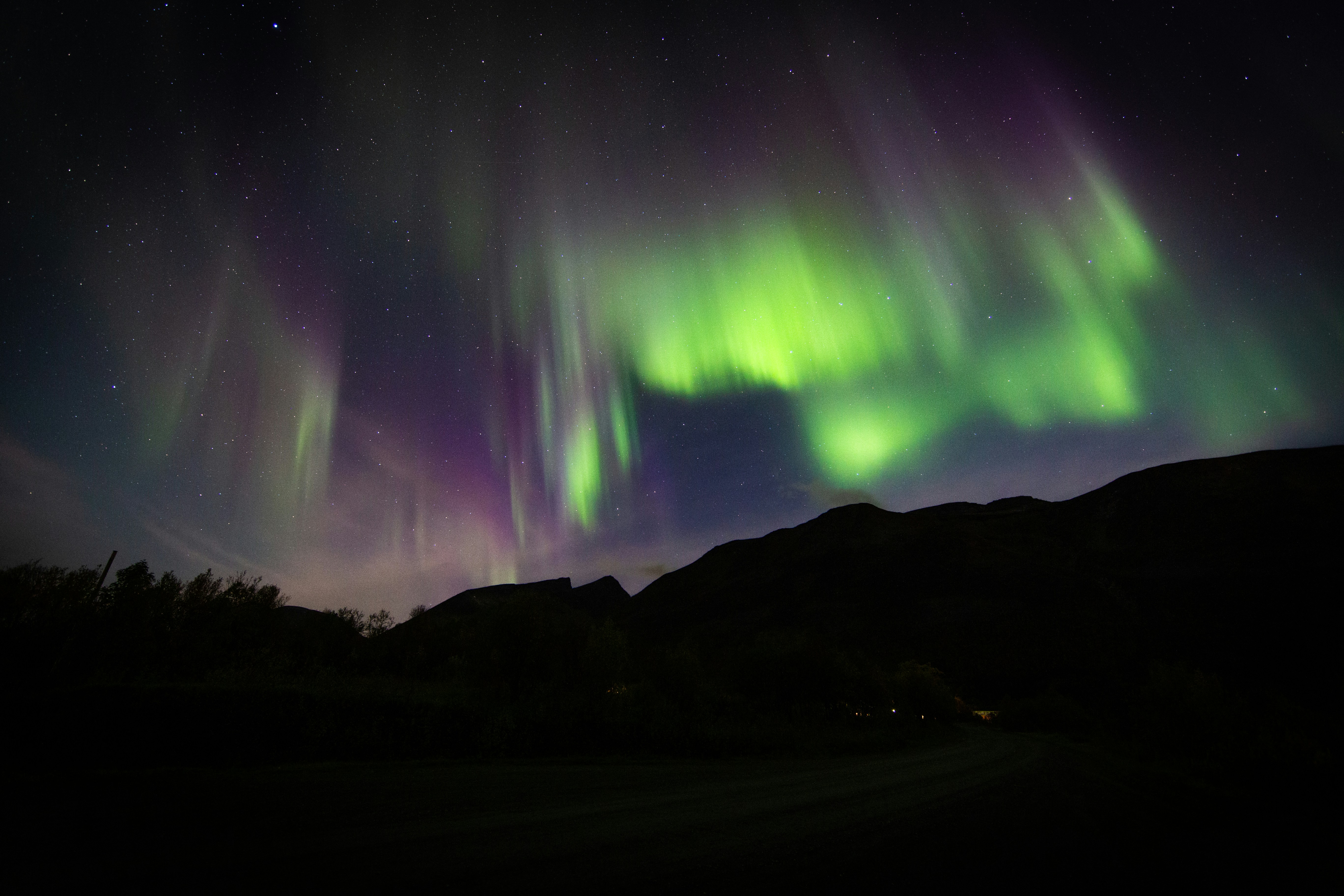 Aurora Over Mountain Night Sky