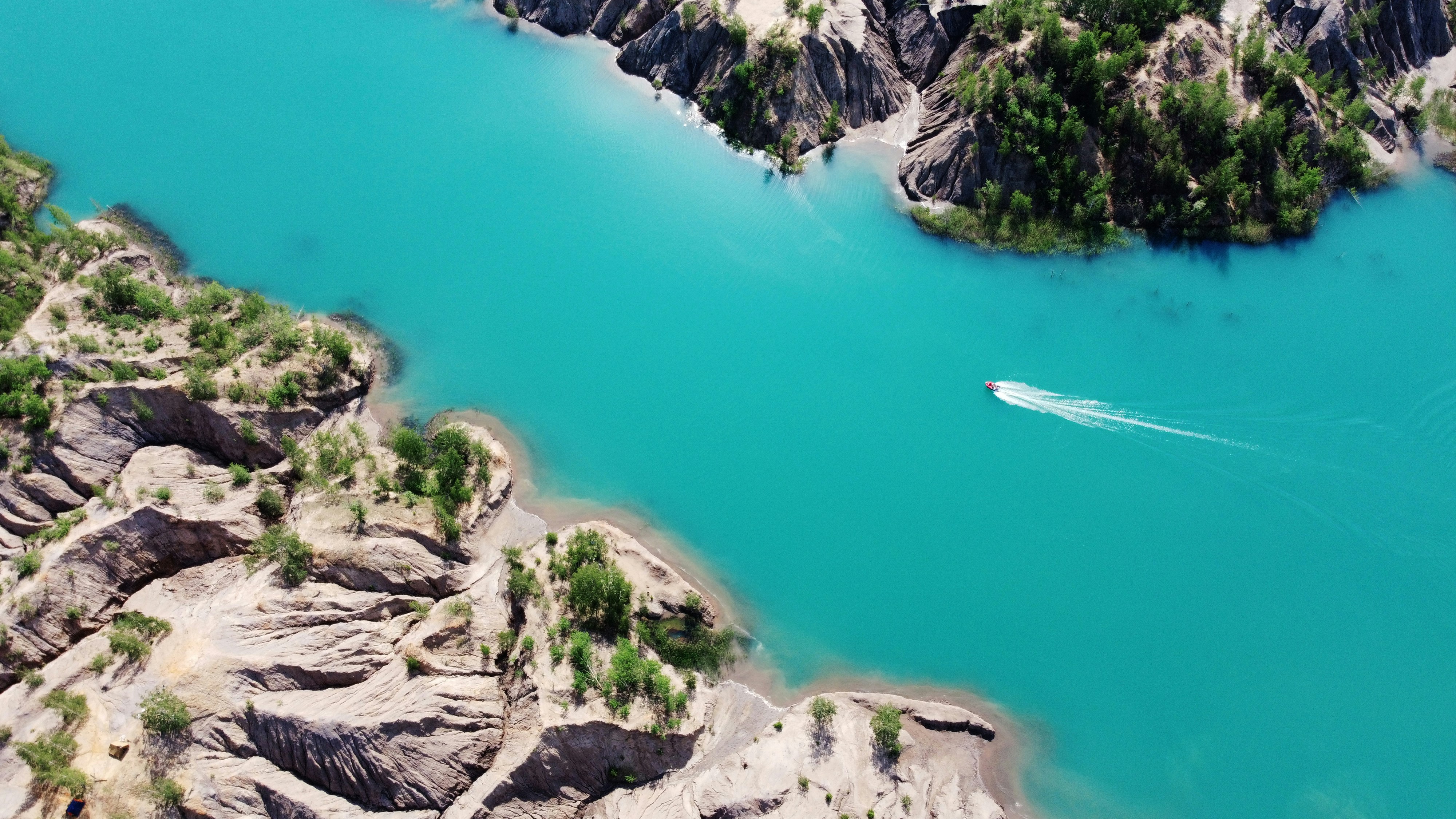 Turquoise Lake With Speedboat