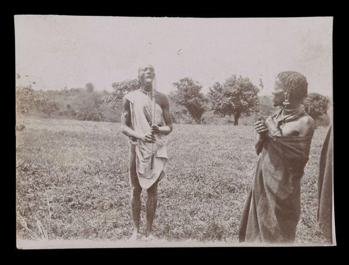 Two Indigenous Men in Grassy Field