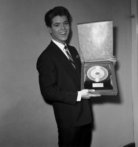 Cliff Richard Holding Gold Record Award