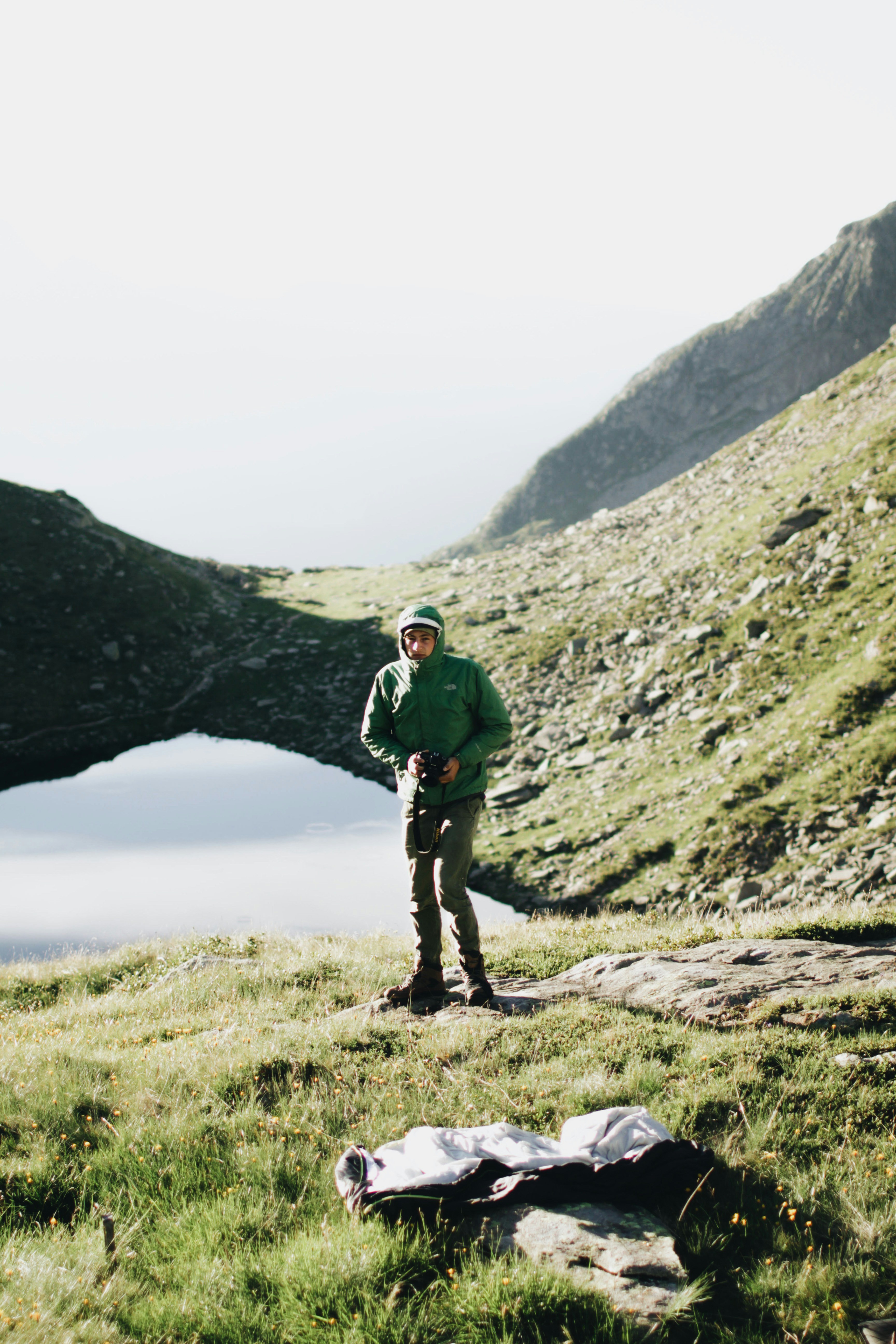 Hiker Photographer on Mountain Slope