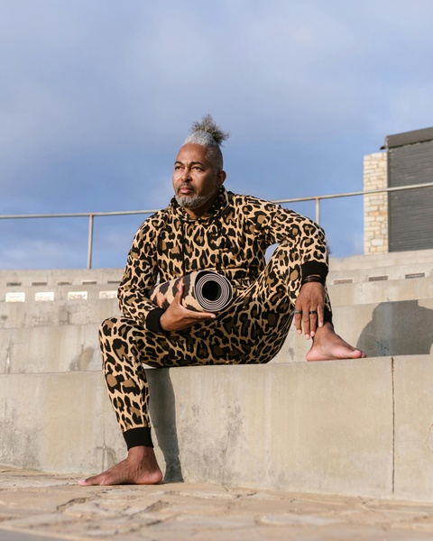 Man in Leopard Print with Yoga Mat Outdoors