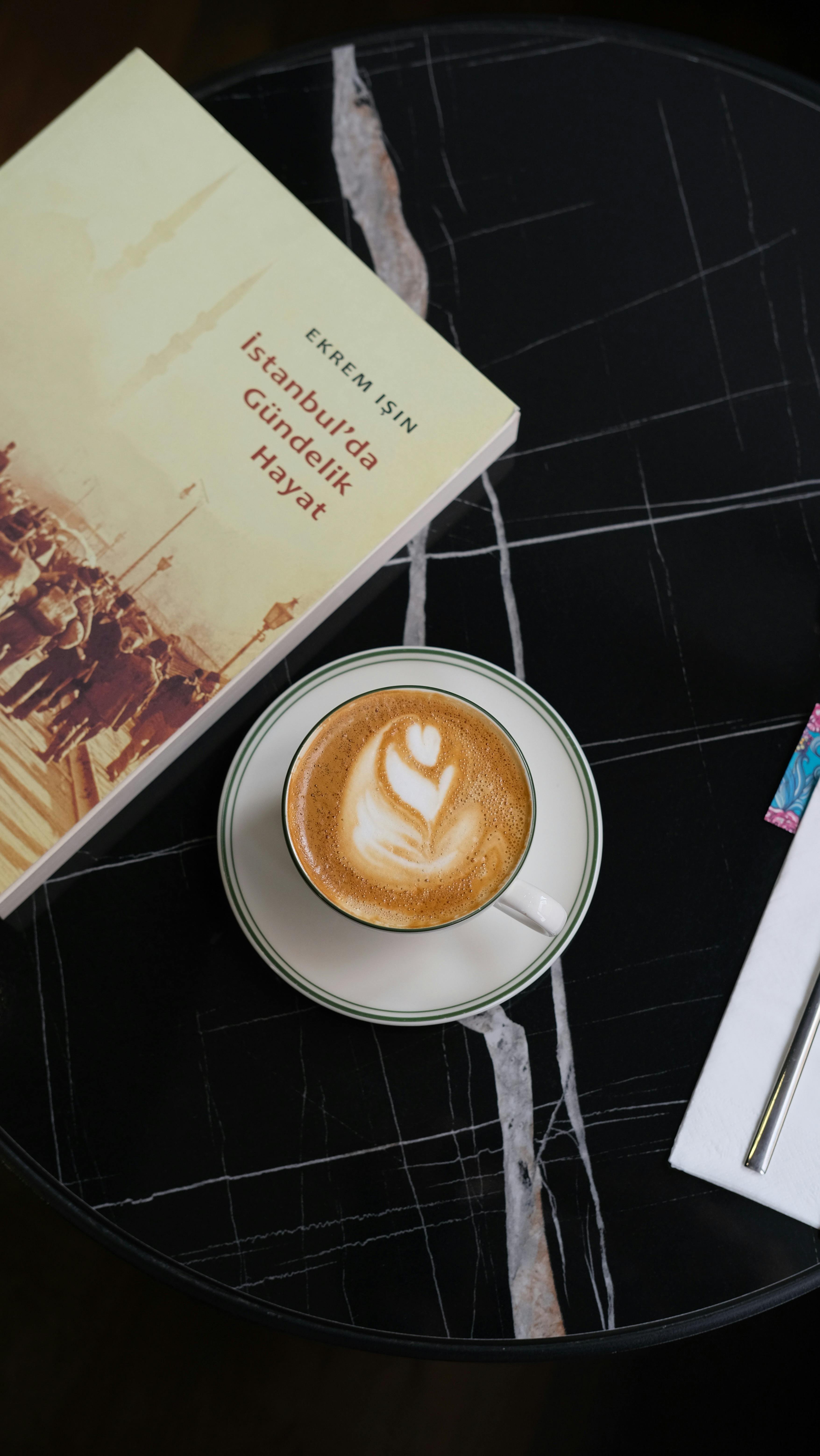 Coffee and Book on Marble Table
