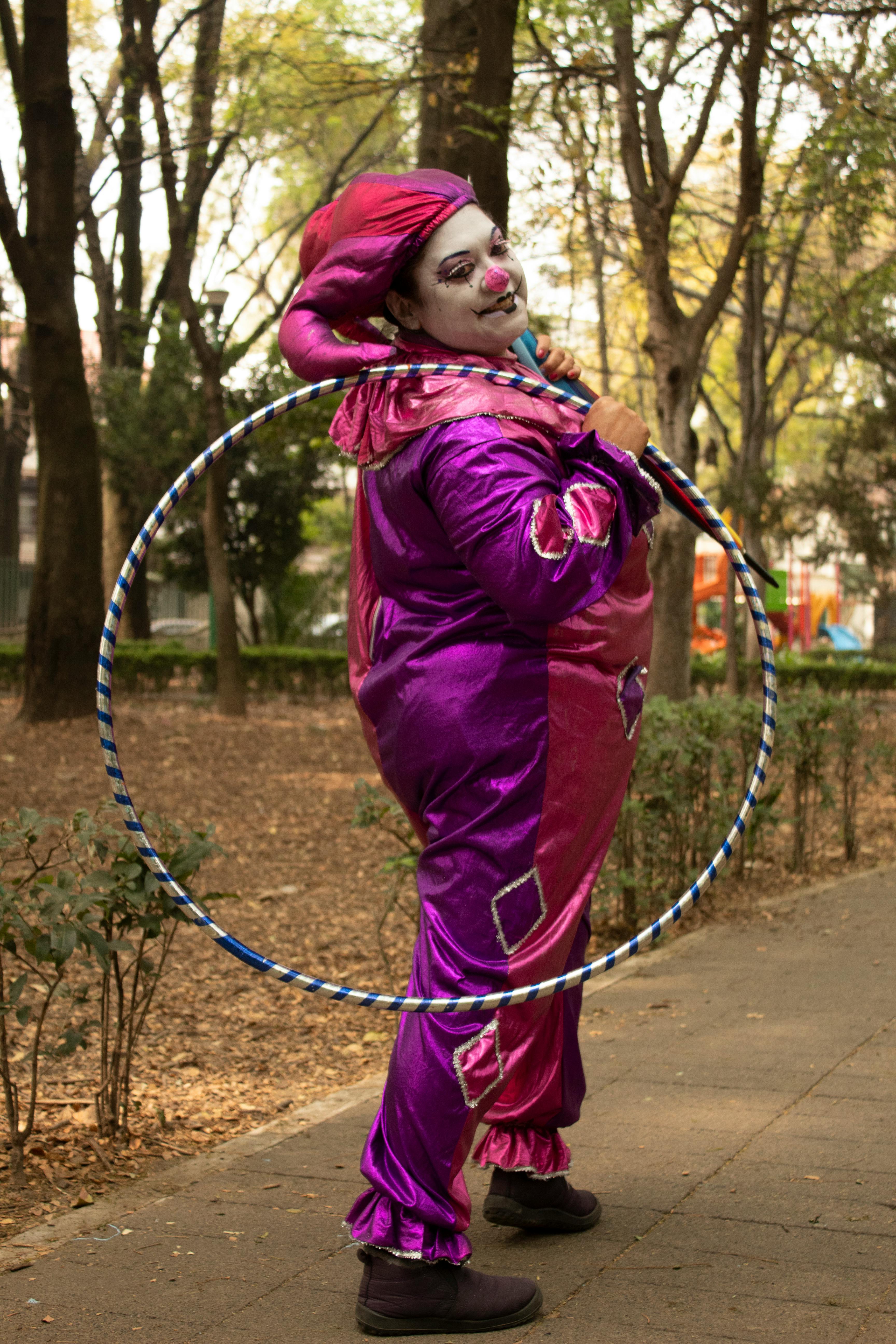 Clown Holding Hula Hoop in Park