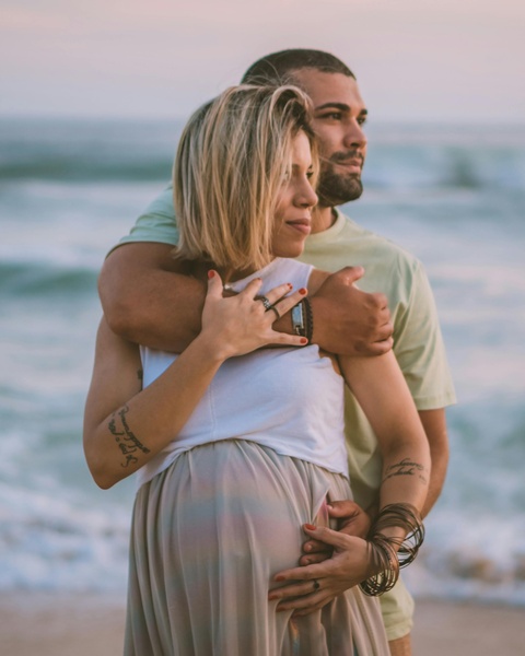 Pregnant Couple At Beach