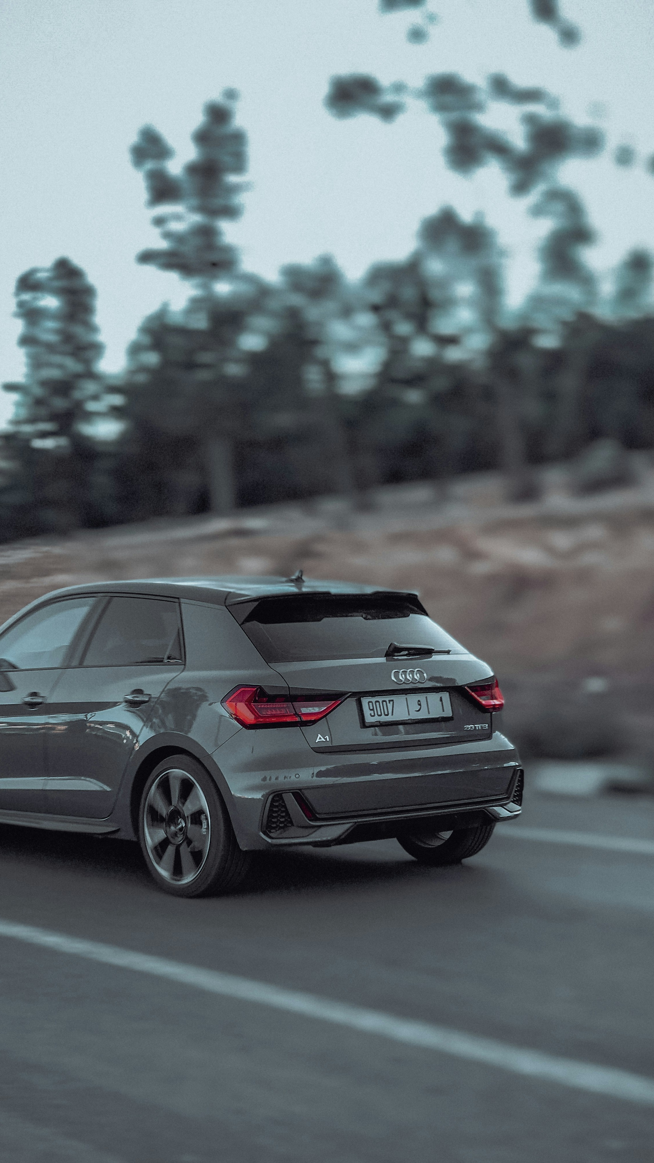 Gray Audi A1 Driving on Road