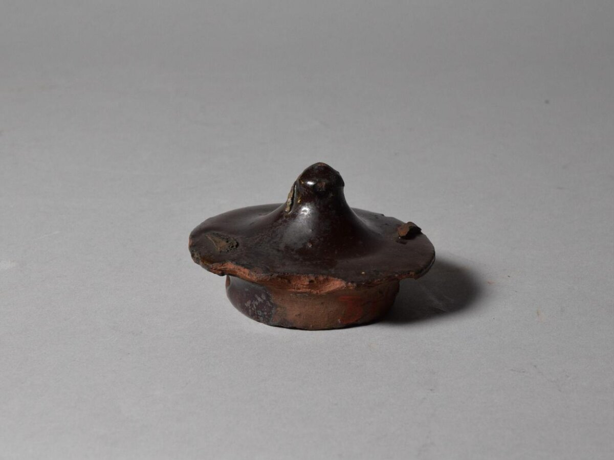 Ancient Dark Glazed Pottery Lid