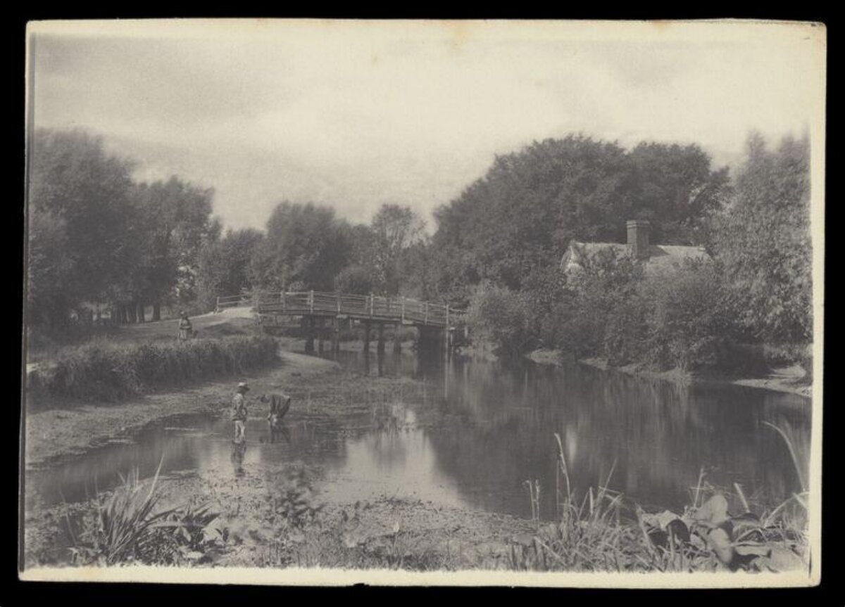 Vintage River Scene with Wooden Footbridge