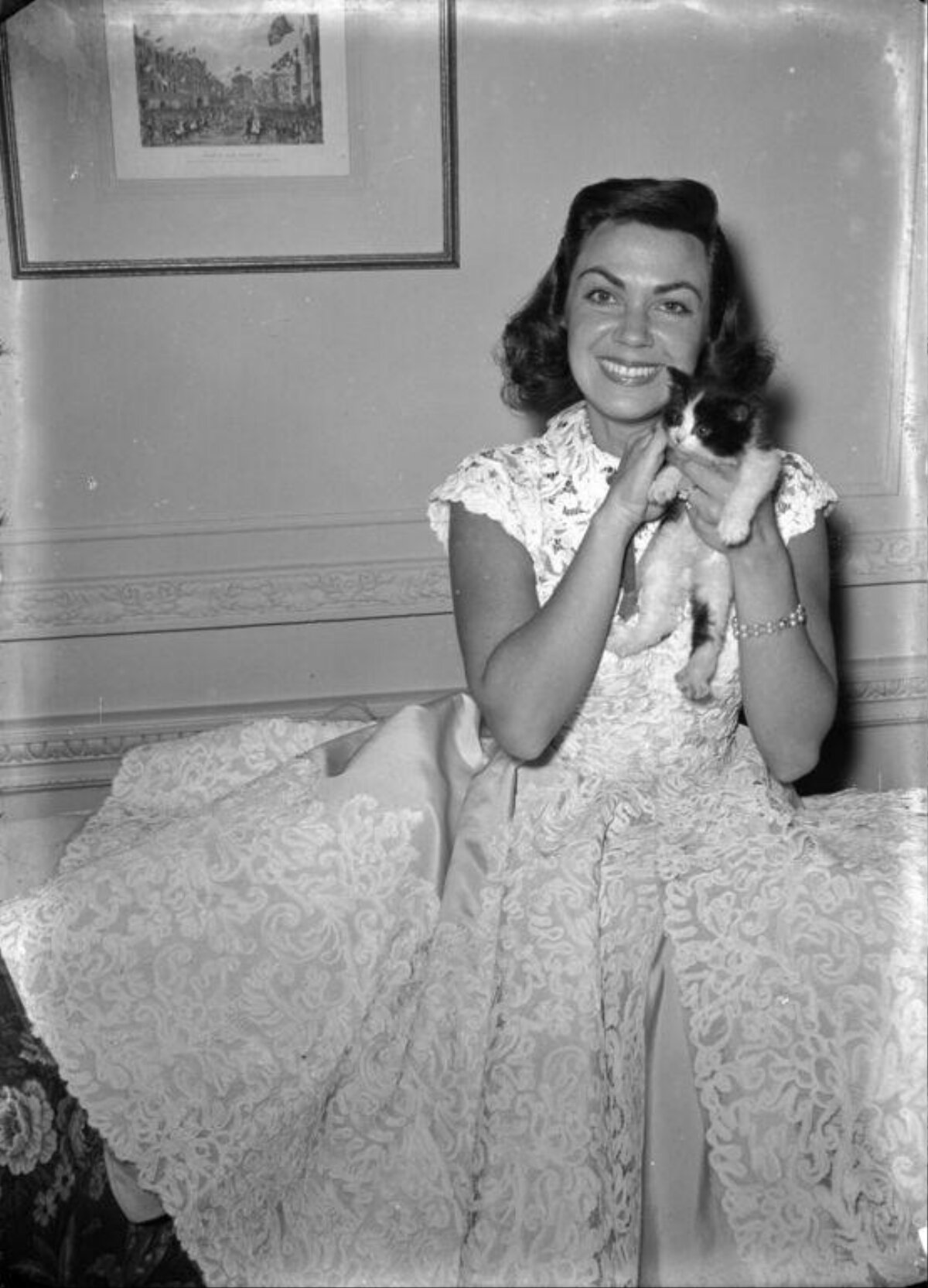 Smiling Woman Holding Kitten
