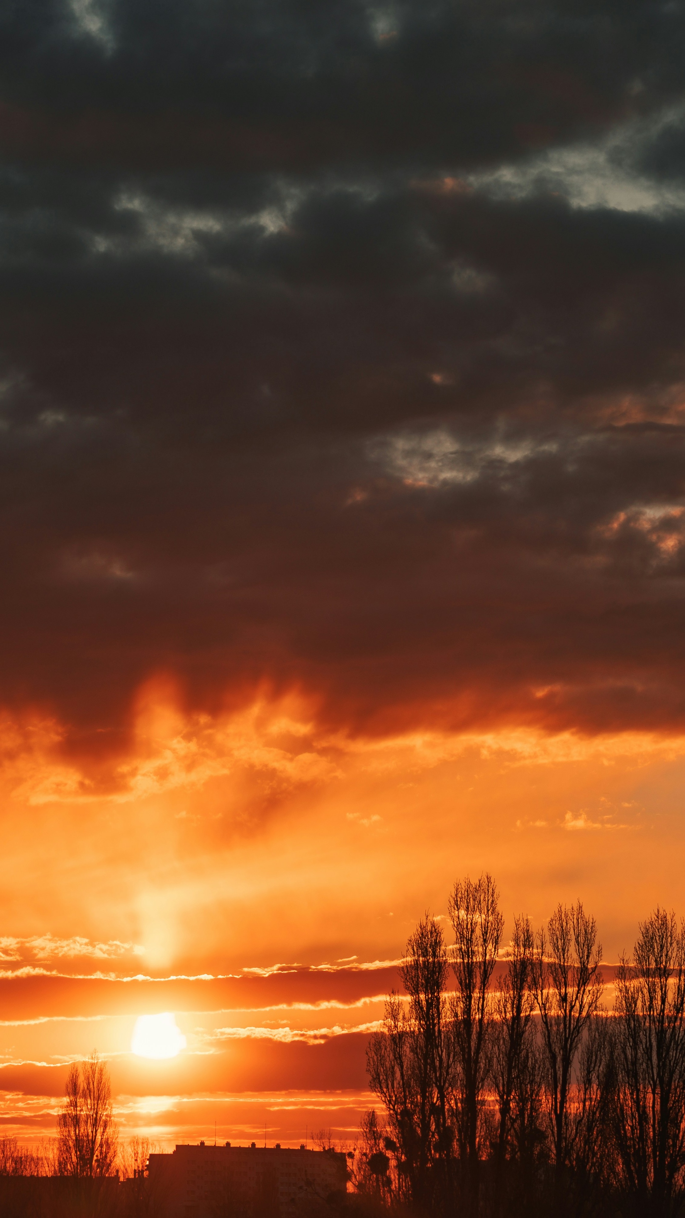 Dramatic Orange Sunset Over City