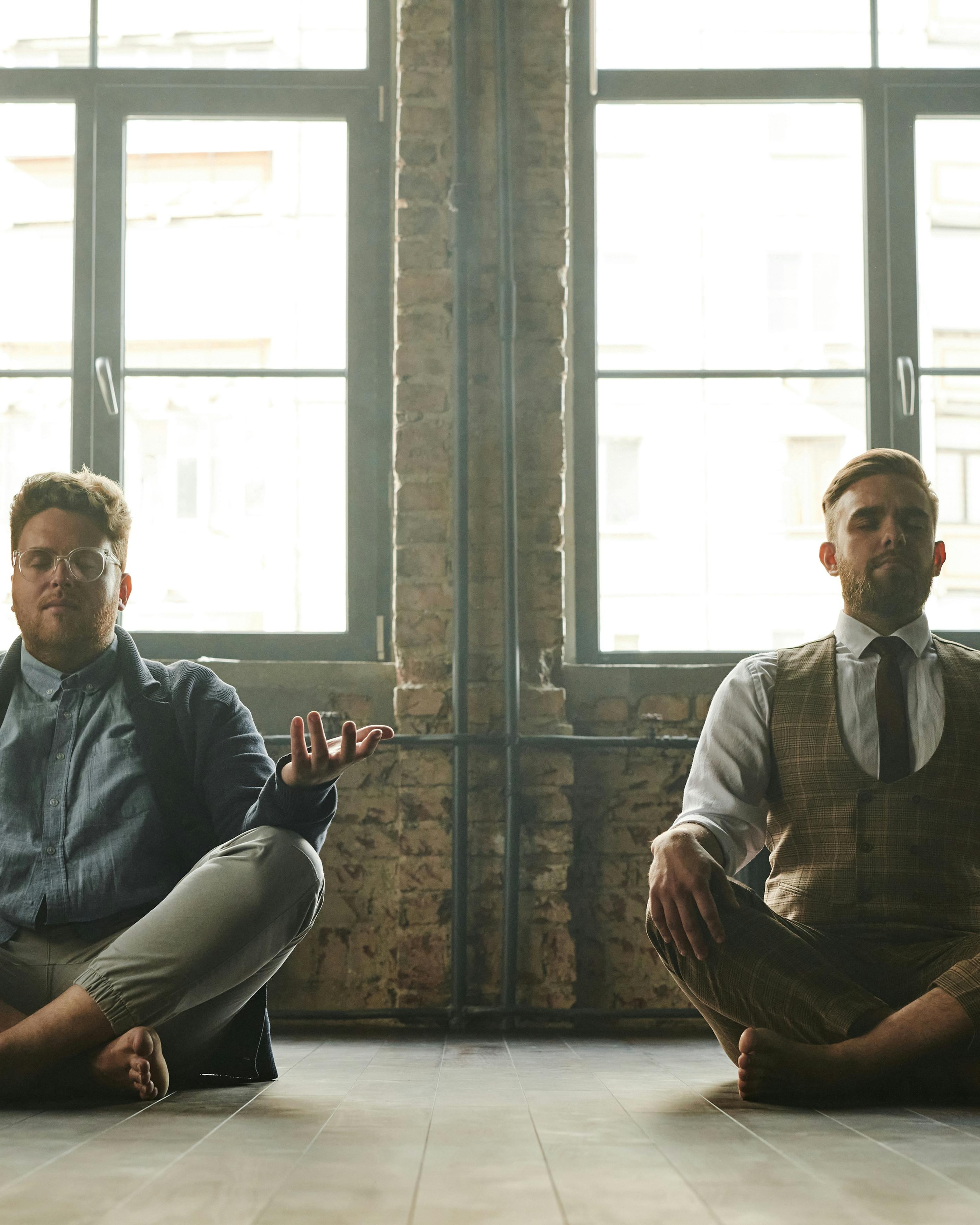 Two Men Meditating in Industrial Space