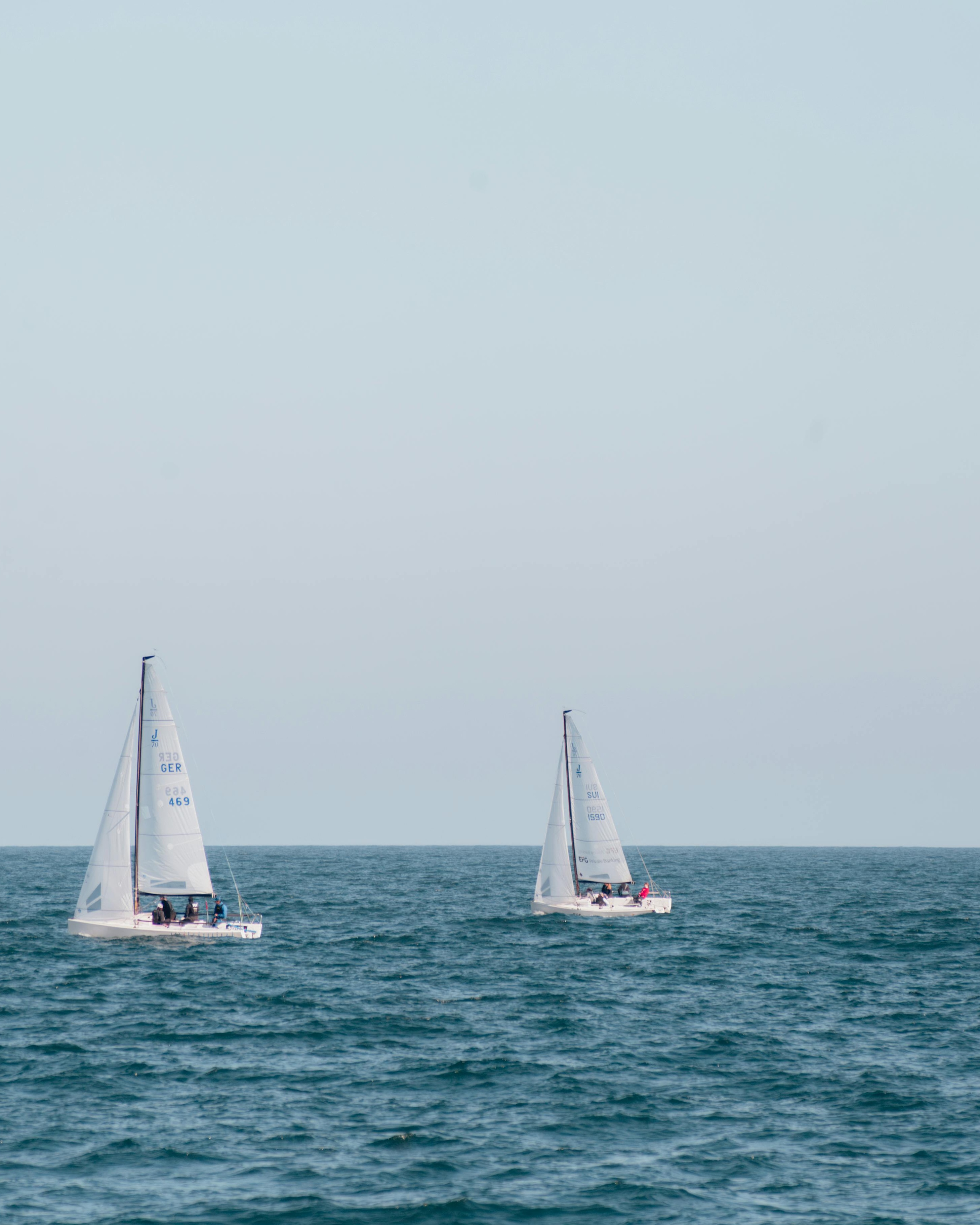 Two Sailboats on Open Sea