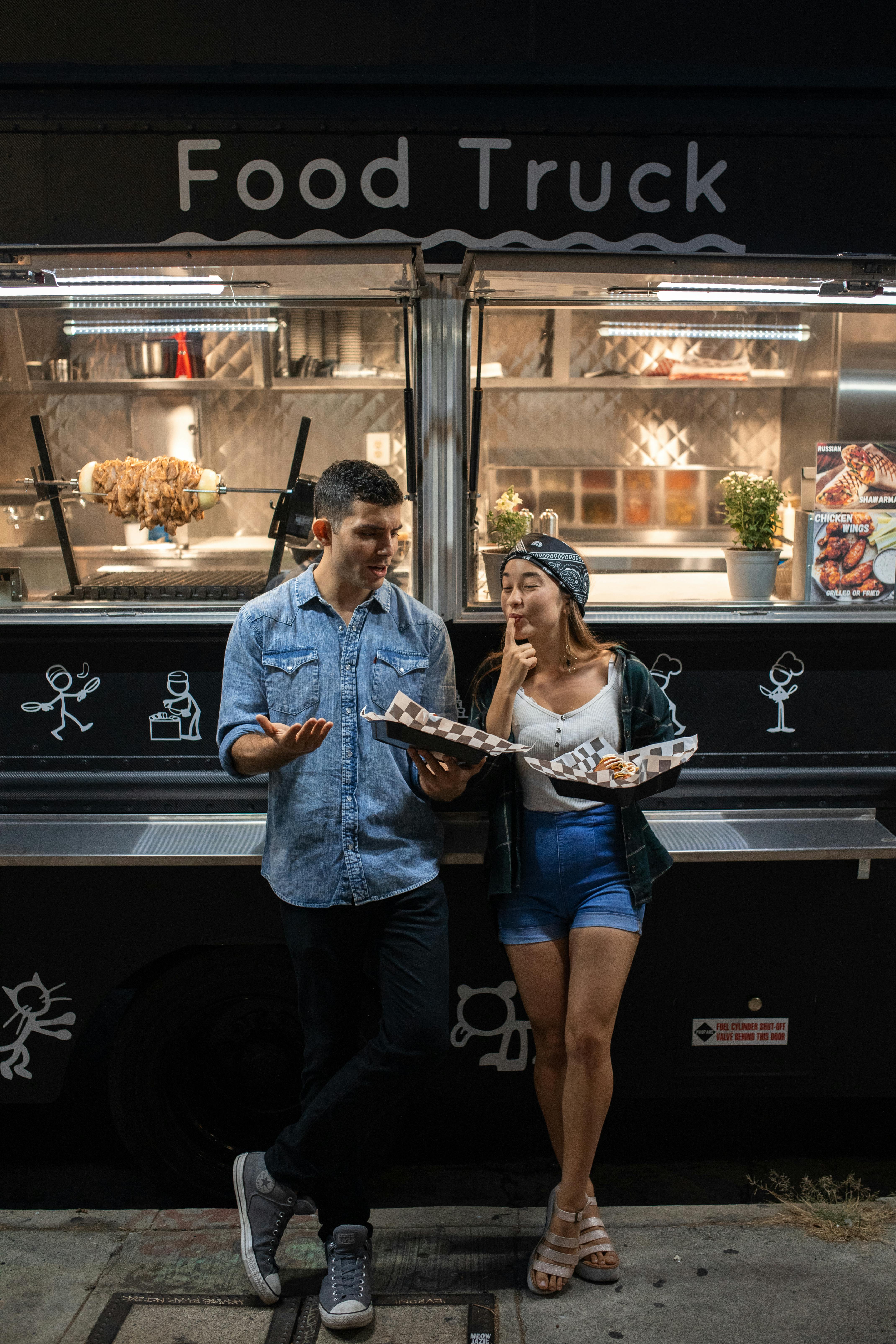 Couple Enjoying Food At Food Truck