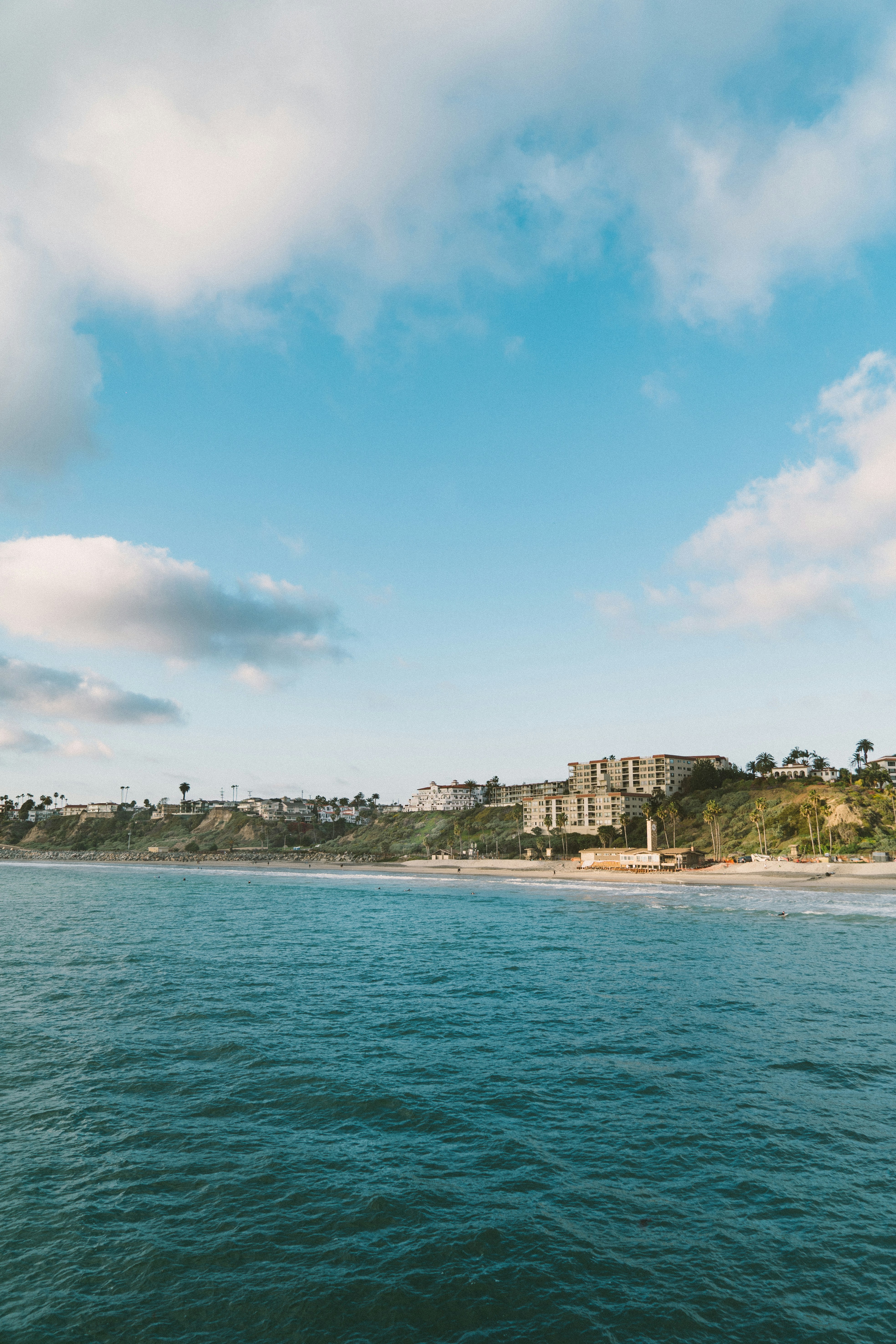 Coastal Beach and Cliffside Town View