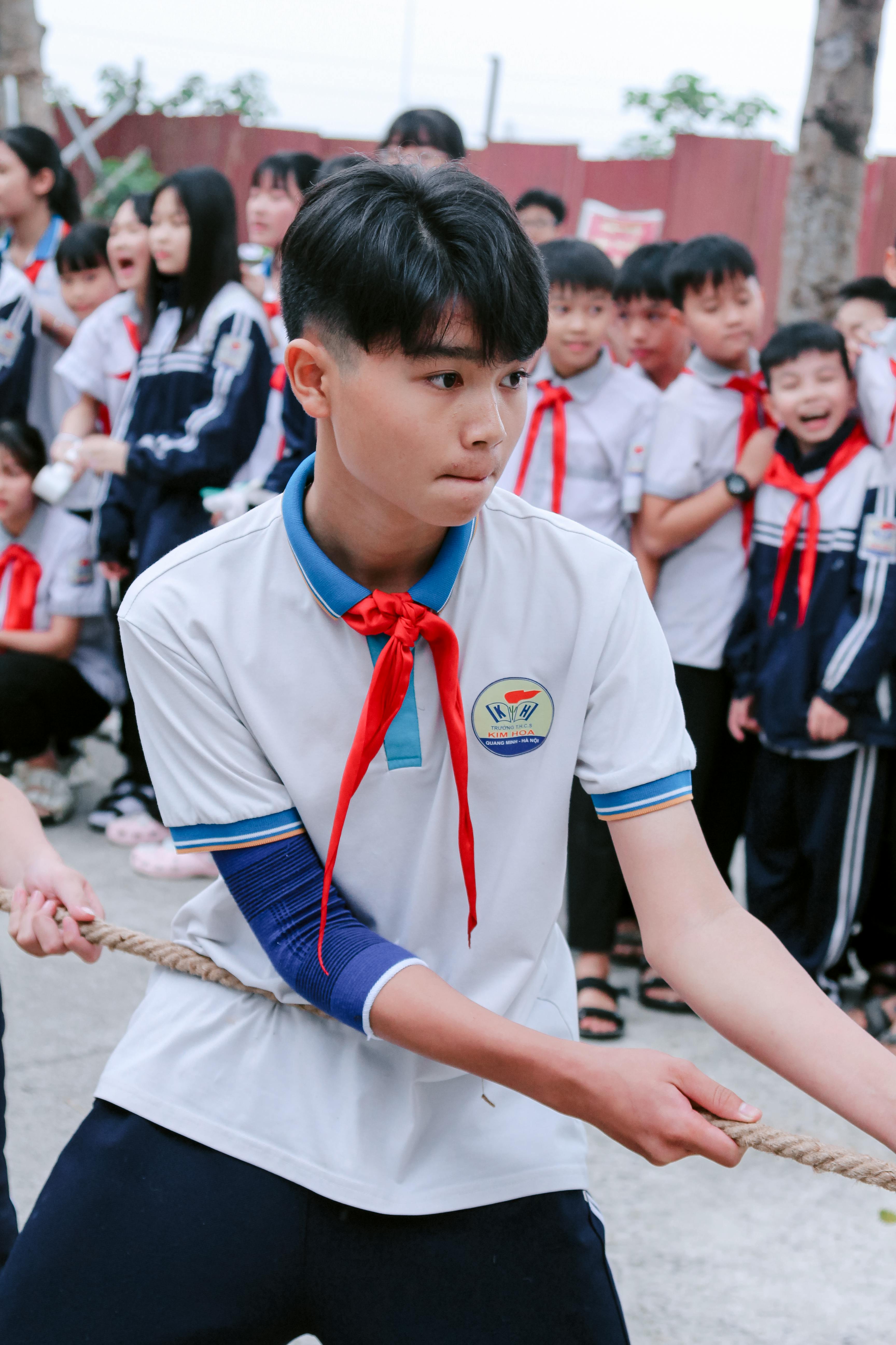 Student competing in school tug of war