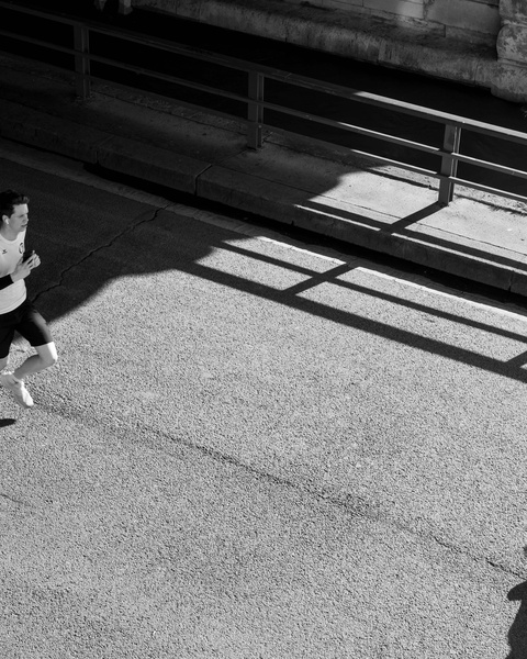 Man Jogging On Urban Paved Path