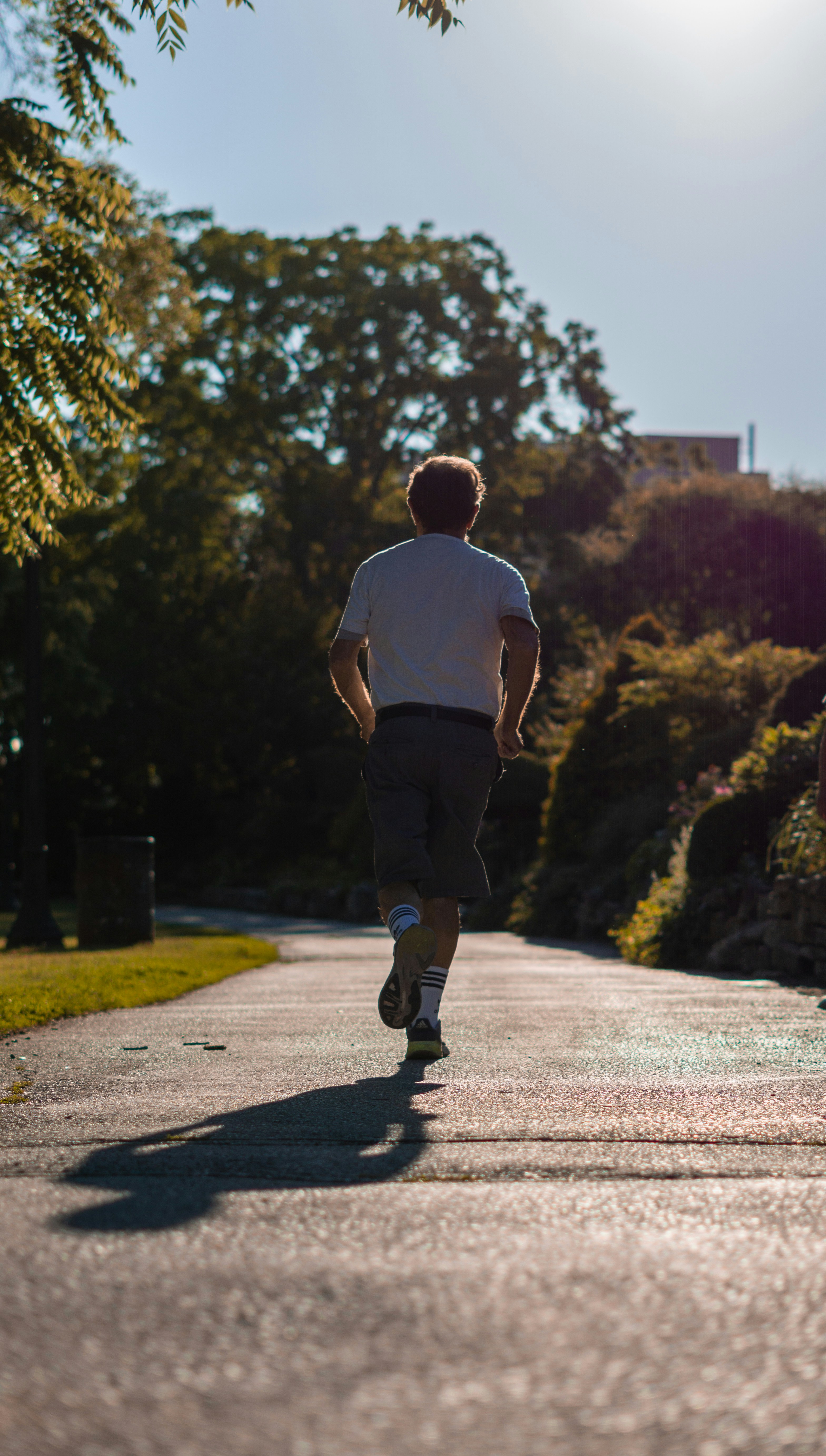 Man Jogging on Park Path