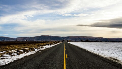 Straight Empty Road to Distant Mountains