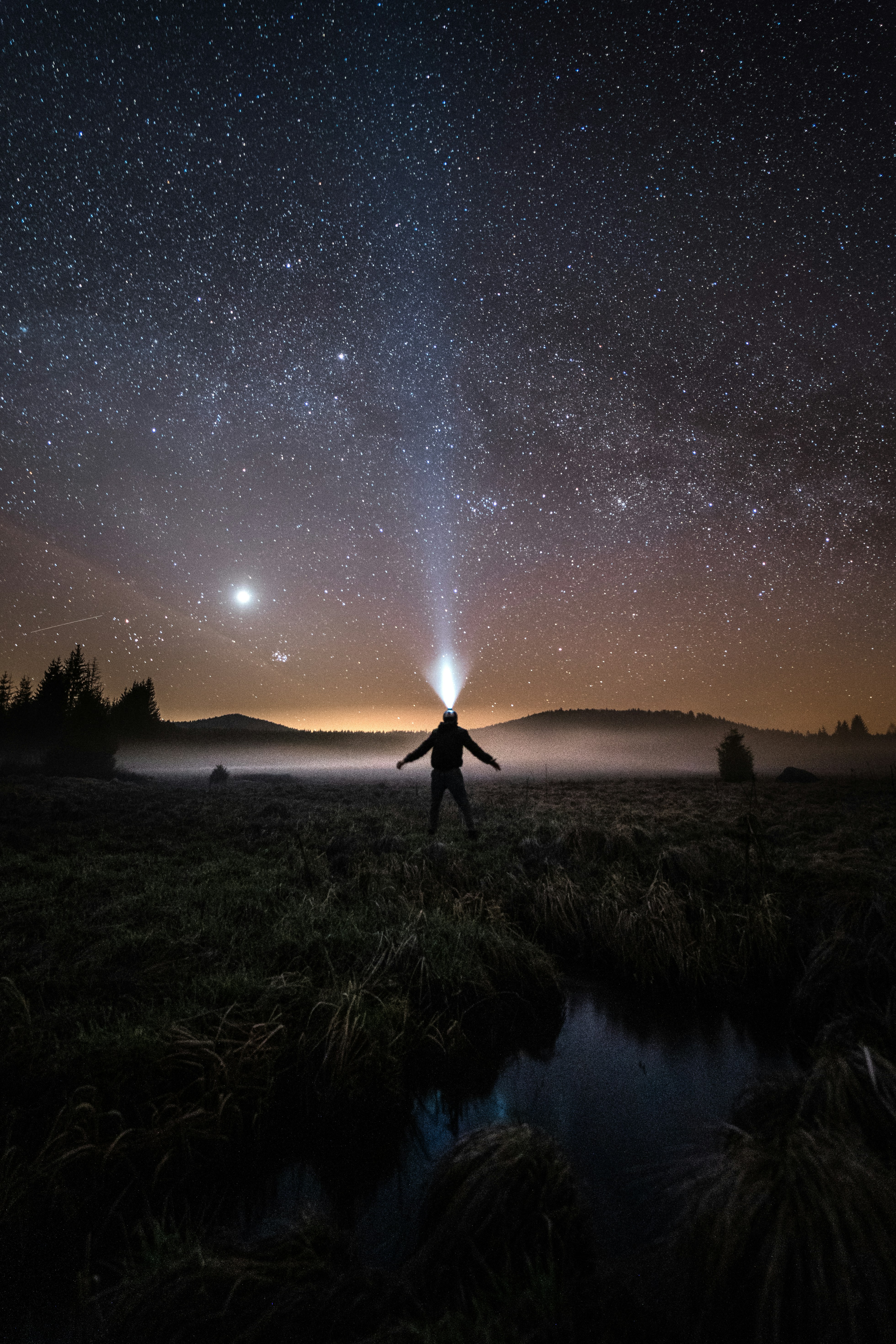 Hiker Under Starry Night Sky