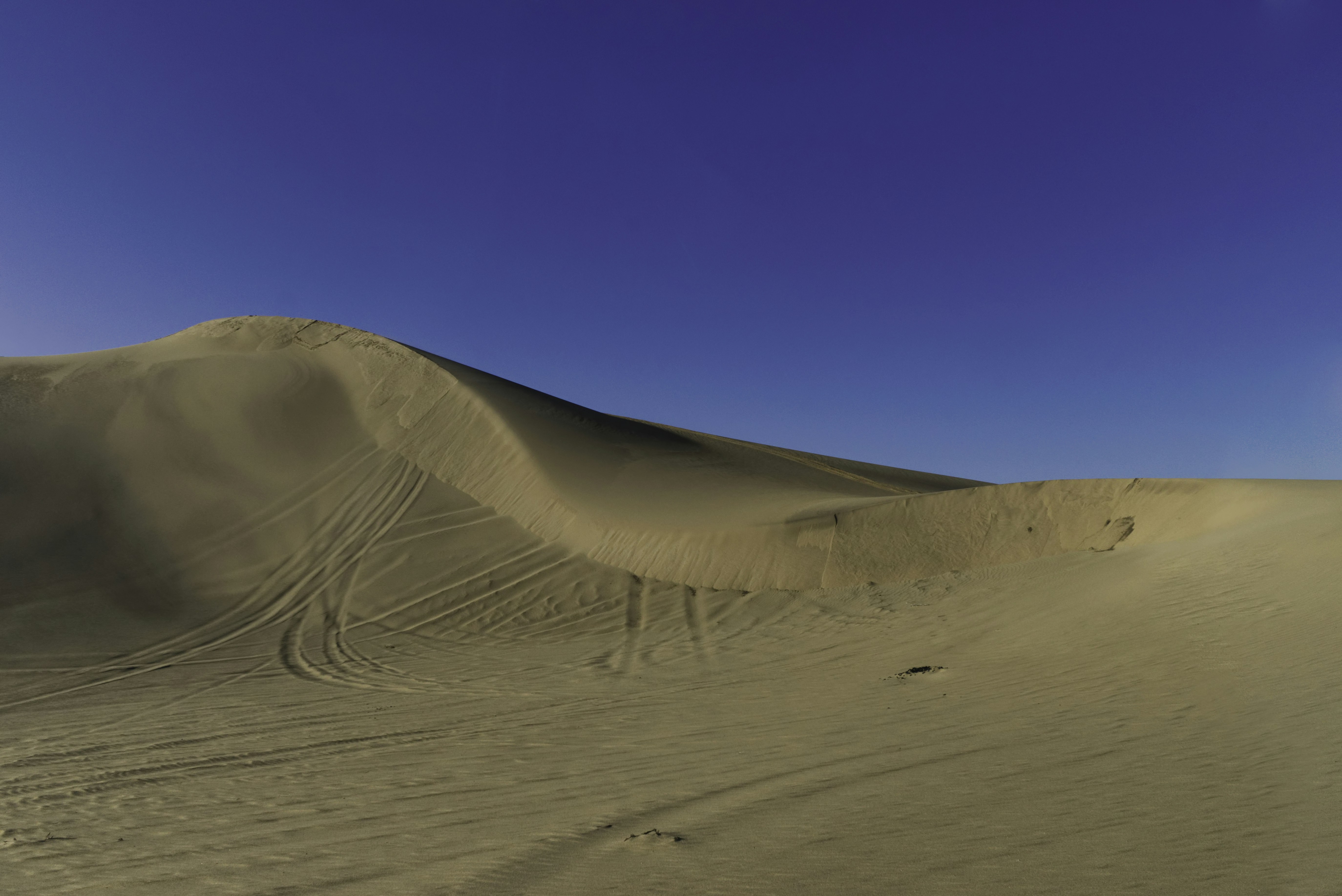 Desert Sand Dune Under Clear Blue Sky