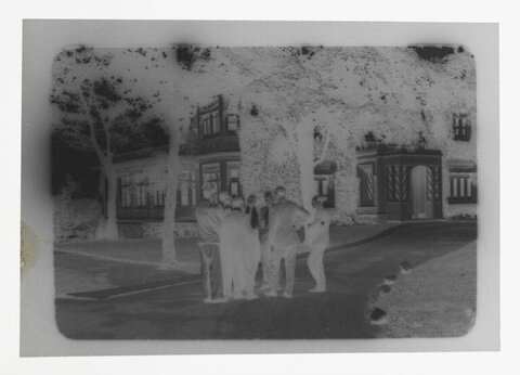 Group of Men Gathered Outside Building
