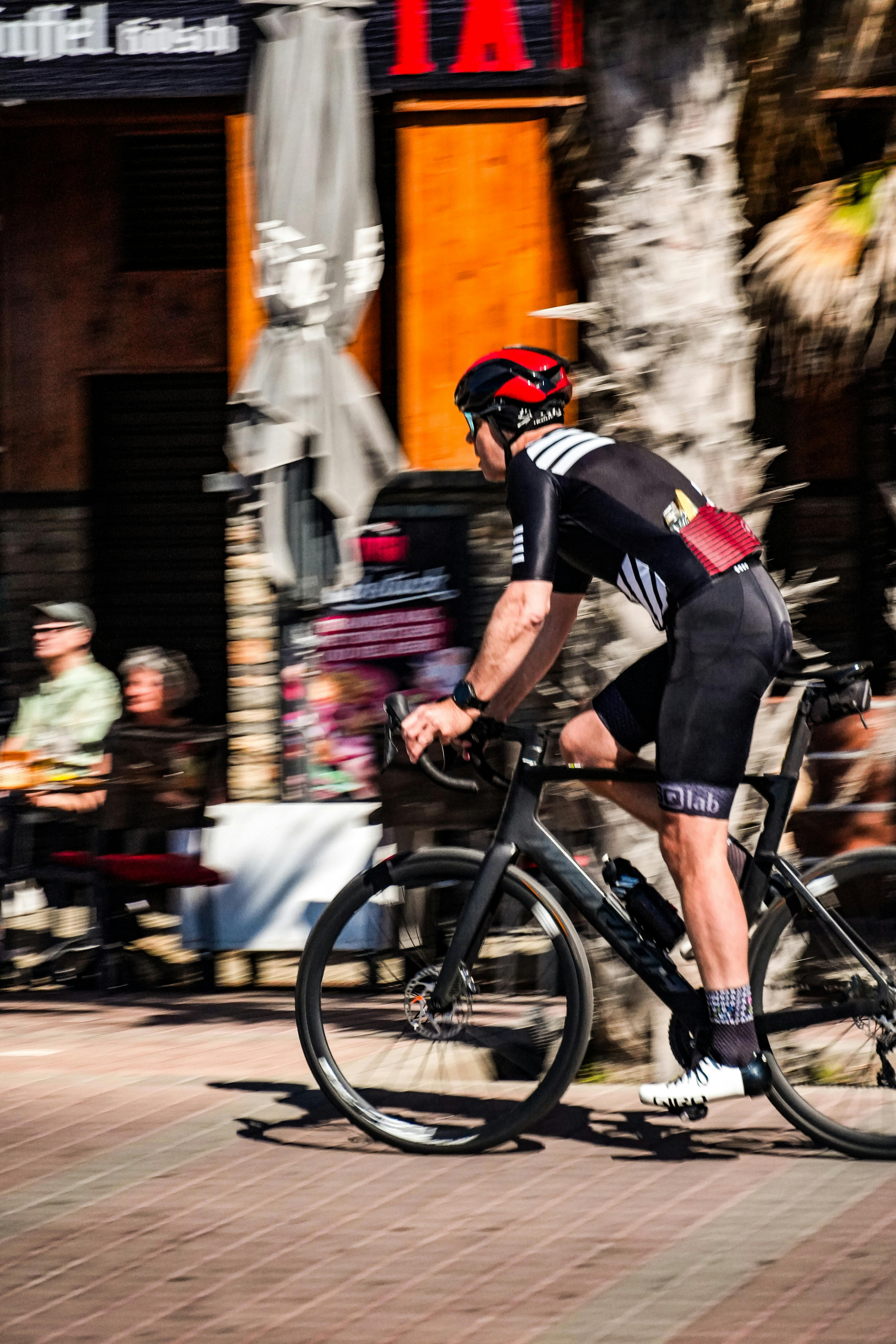 Cyclist Racing Through Downtown Street