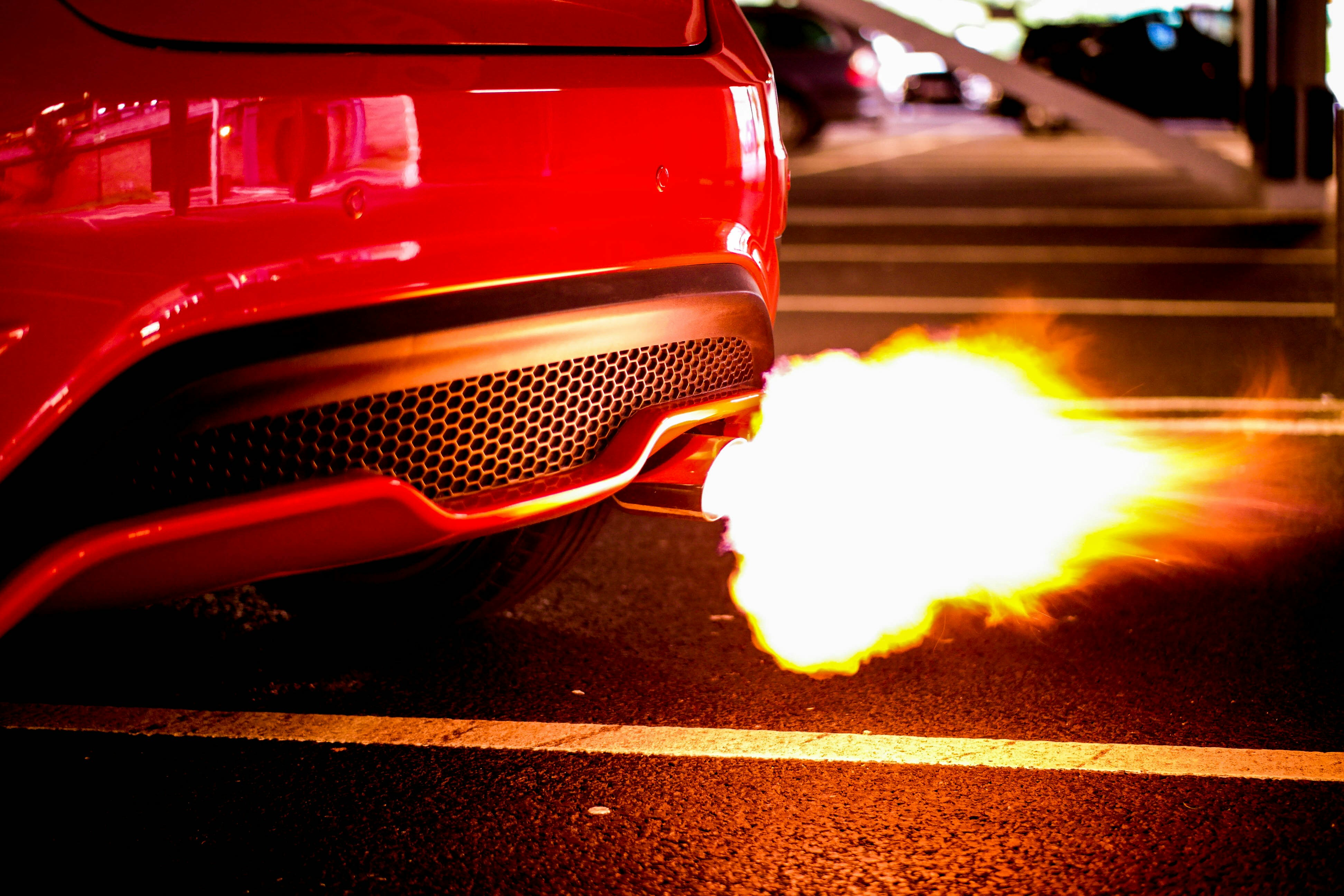 Red Car Exhaust Spitting Flame