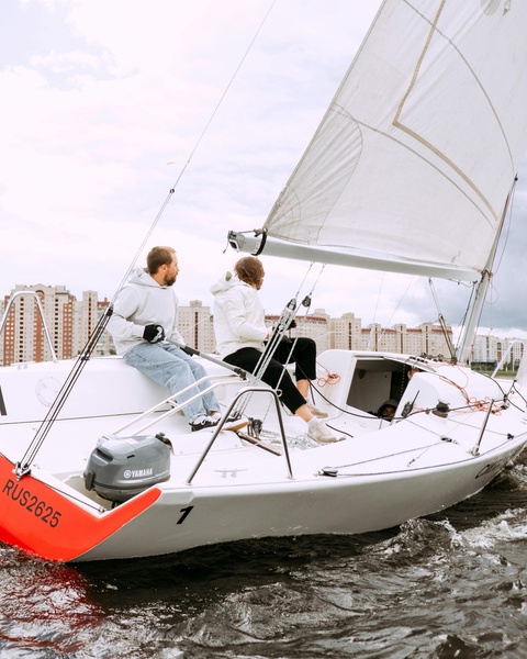 Two Men Sailing on a Sailboat