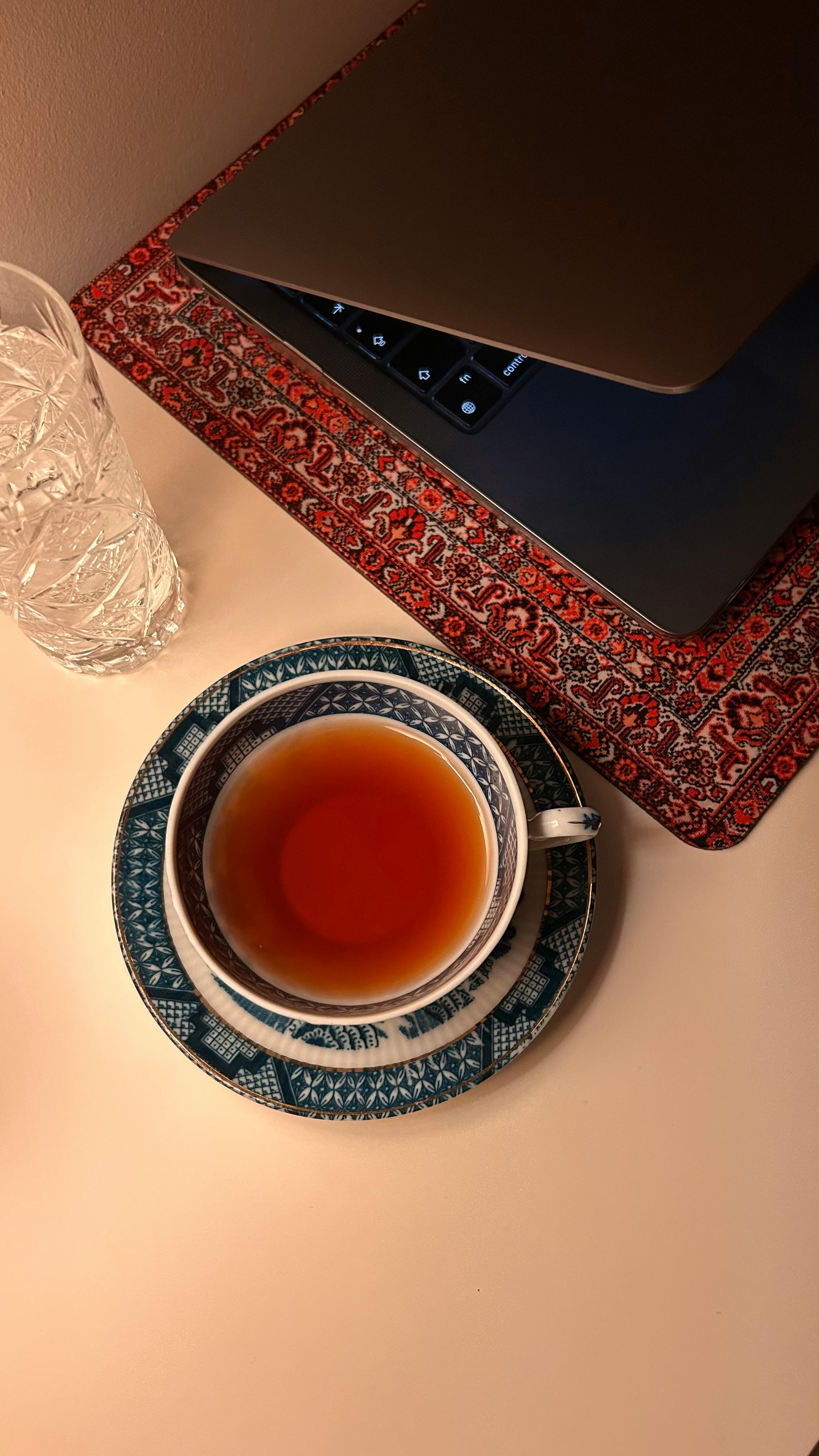 Cozy Workspace With Tea and Laptop