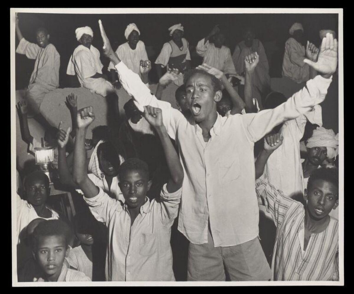 Group of Men Raising Arms in Rally