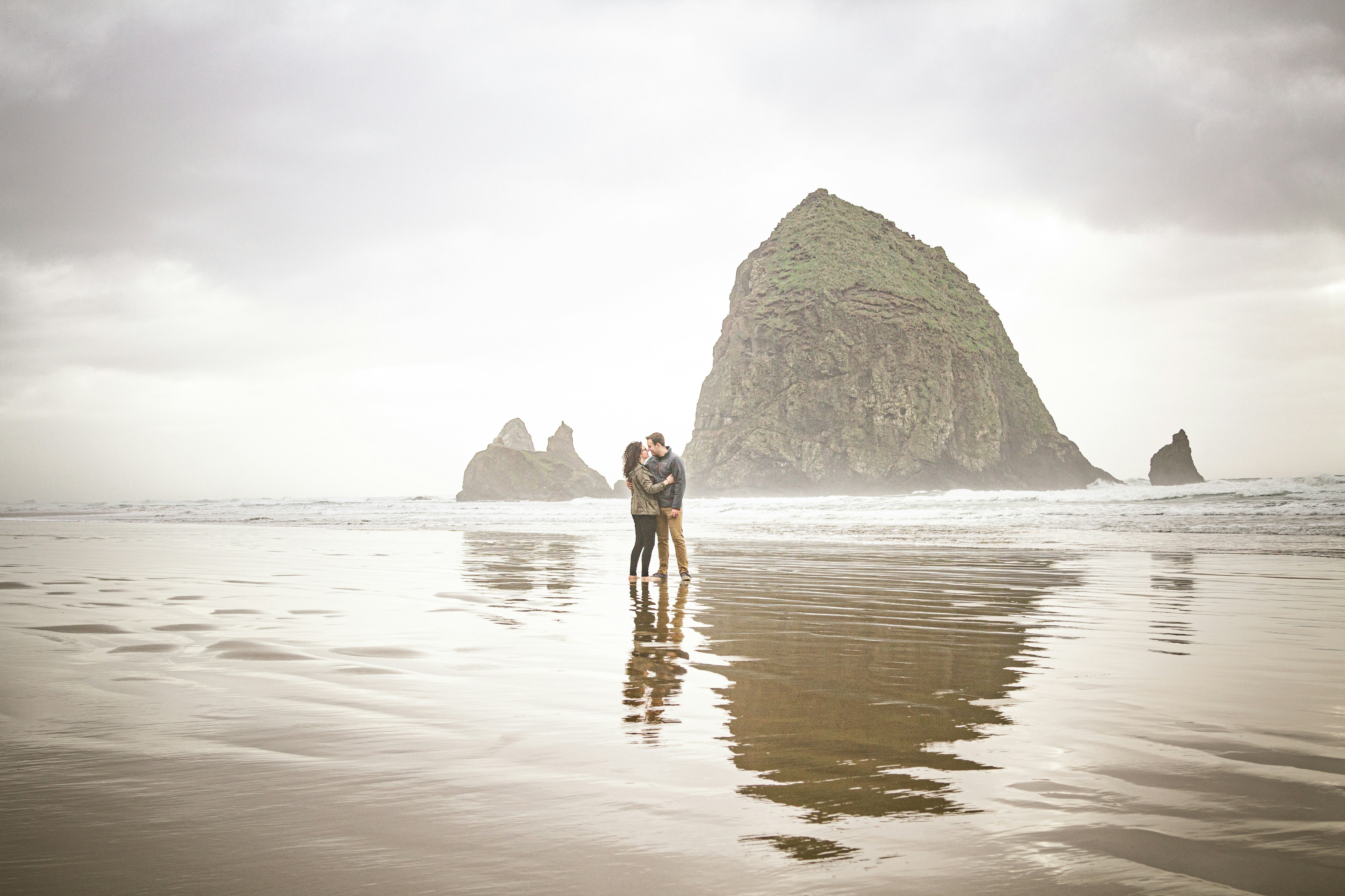 Couple Embracing on Beach by Haystack Rock