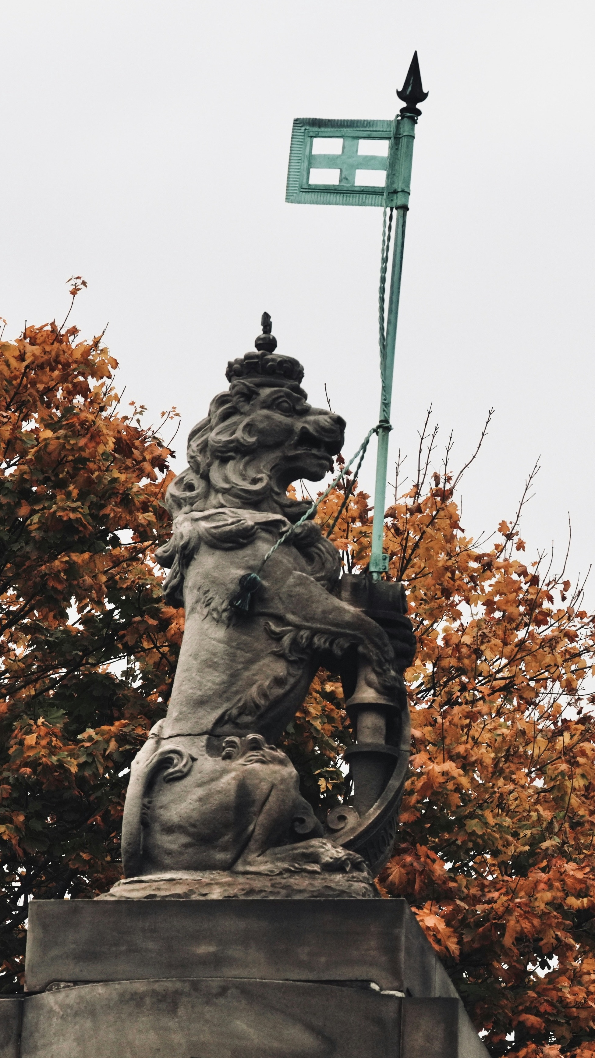 Crowned Lion Statue in Autumn