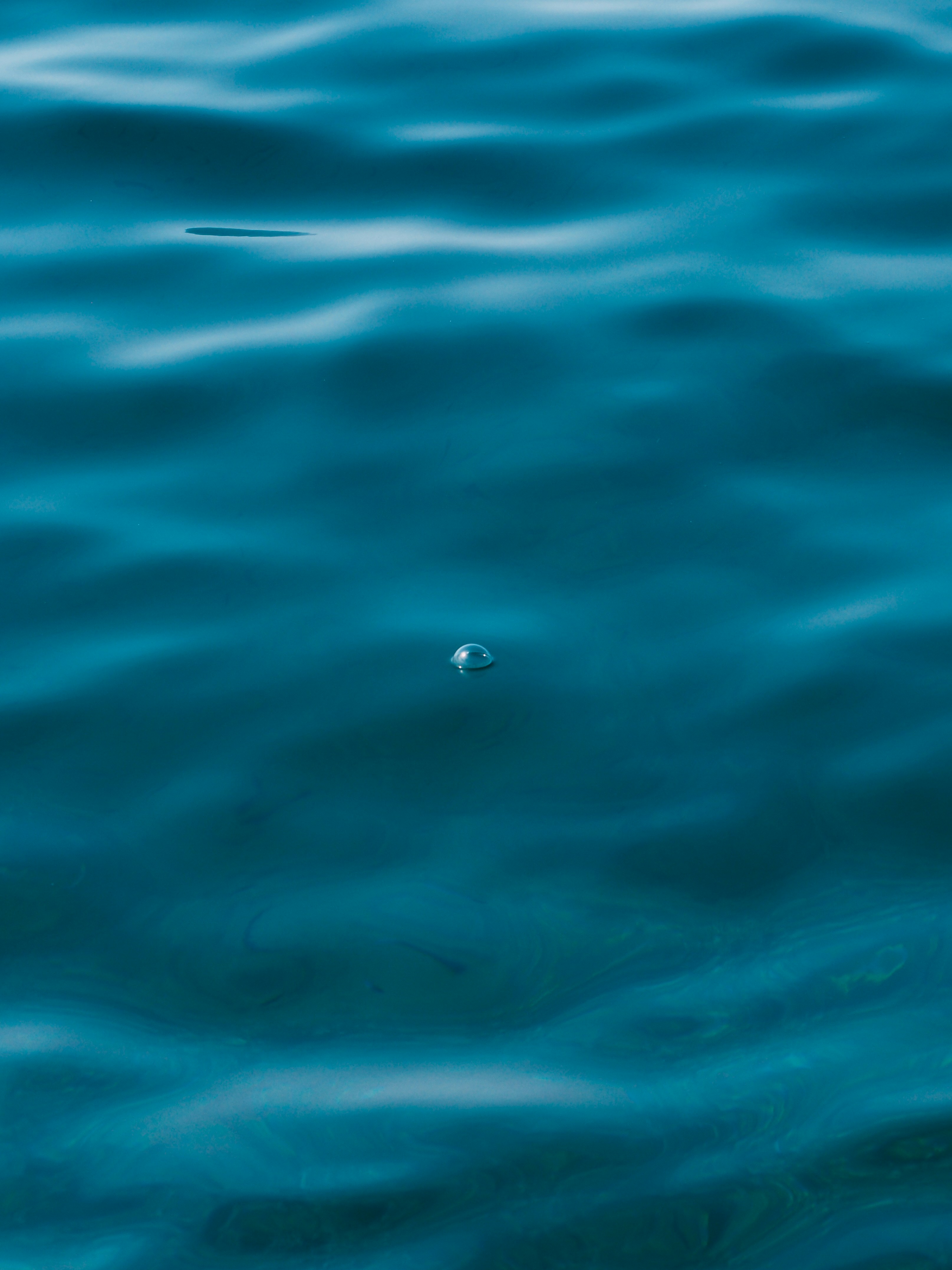 Single Bubble on Teal Water