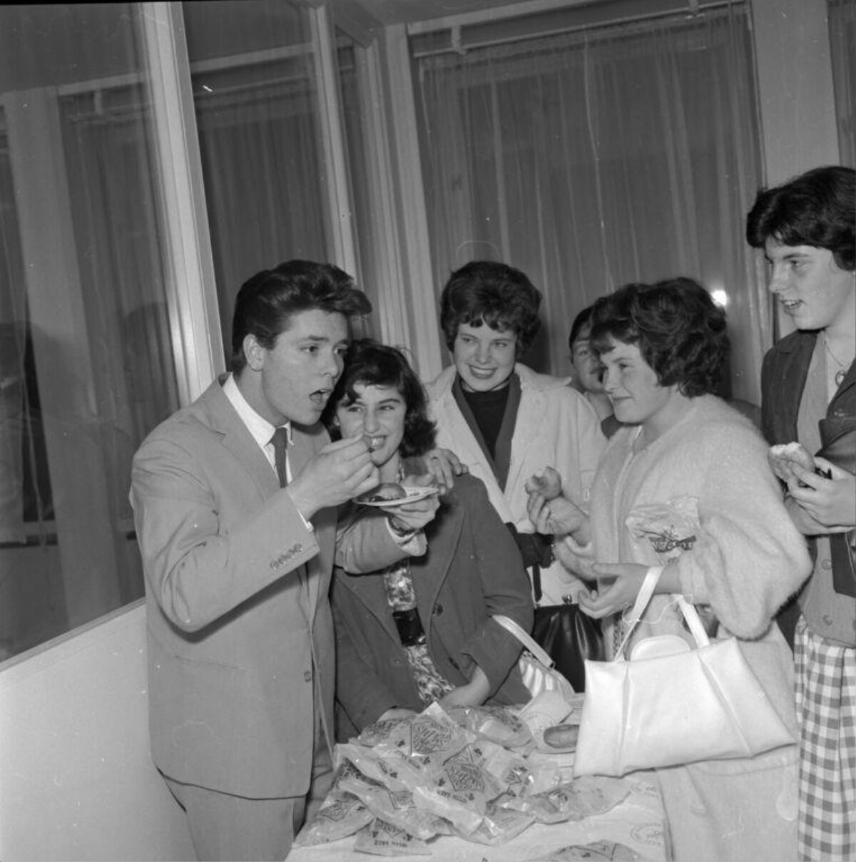 Young Celebrity Eating With Fans