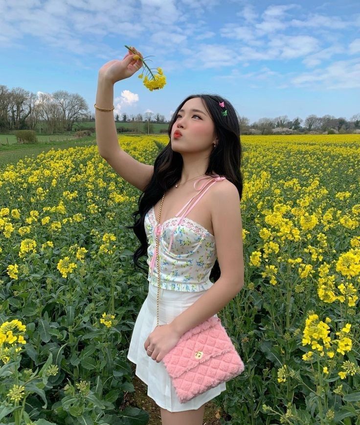 Woman Posing In Yellow Flower Field