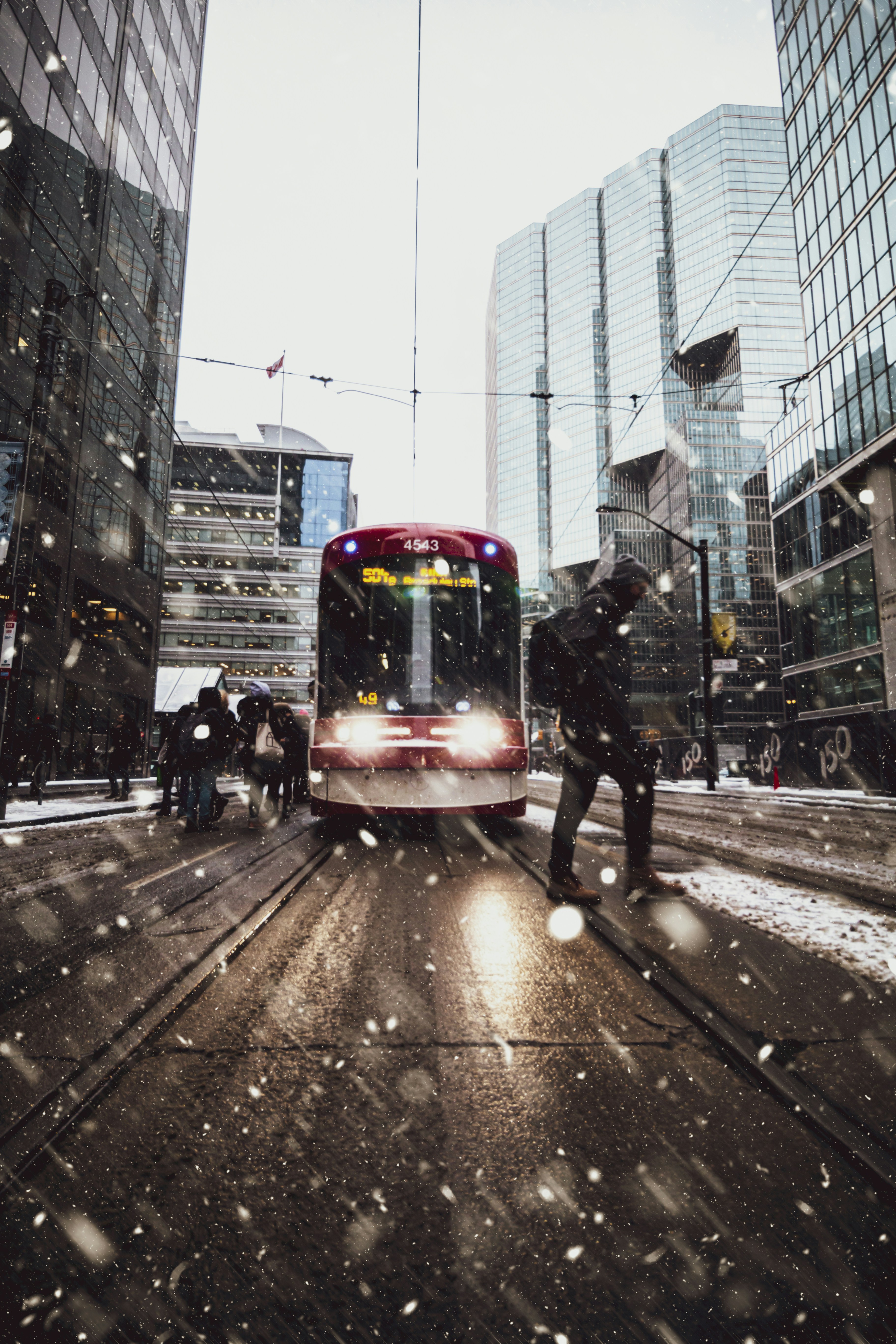 Snowy Downtown Street With Tram