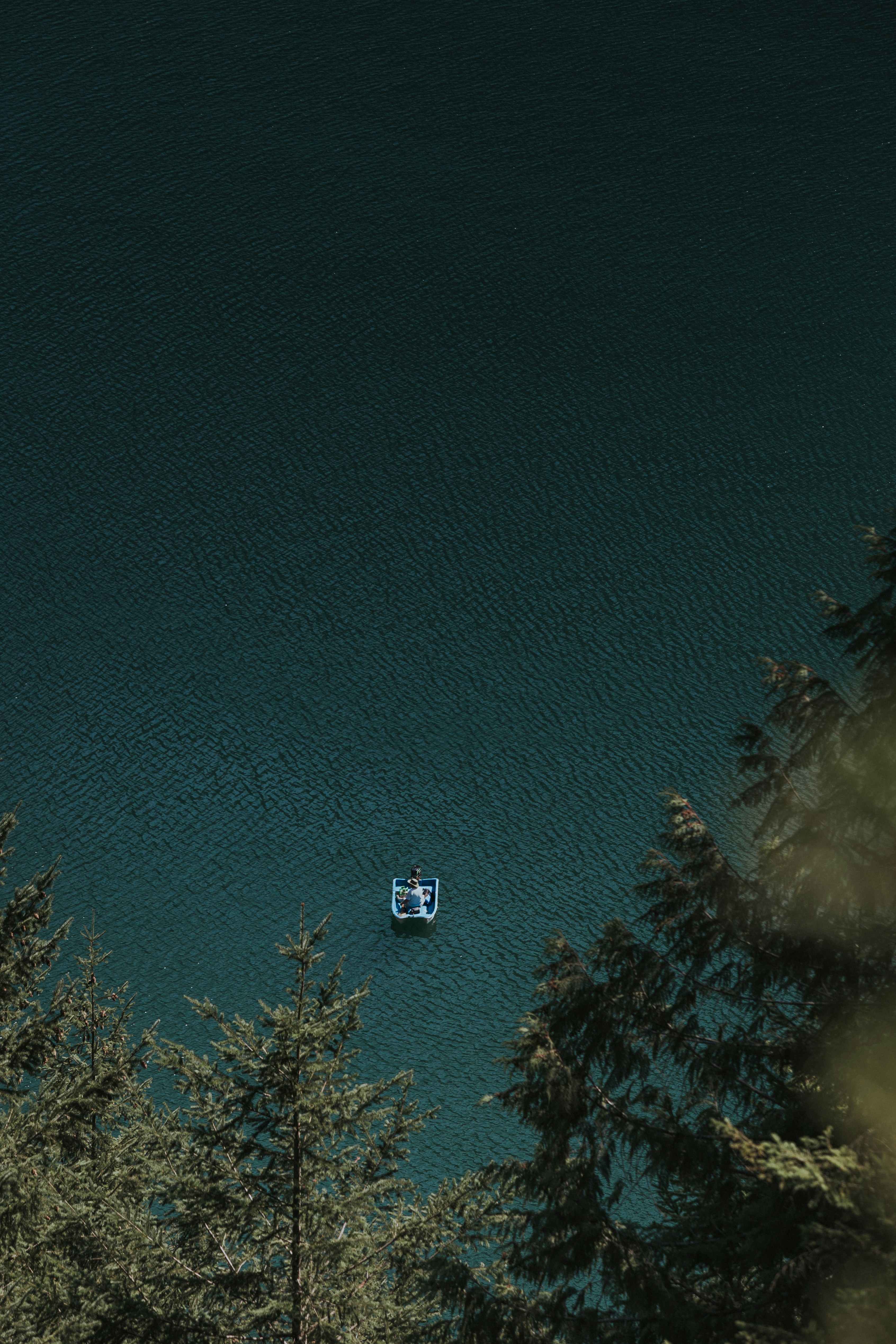 Small Boat on Deep Mountain Lake