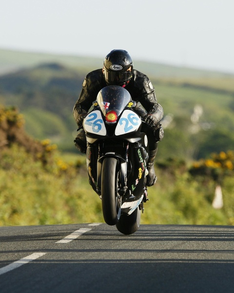 Airborne Racing Motorcycle on Road Course