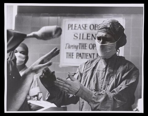 Surgeons Preparing Gloves Before Surgery