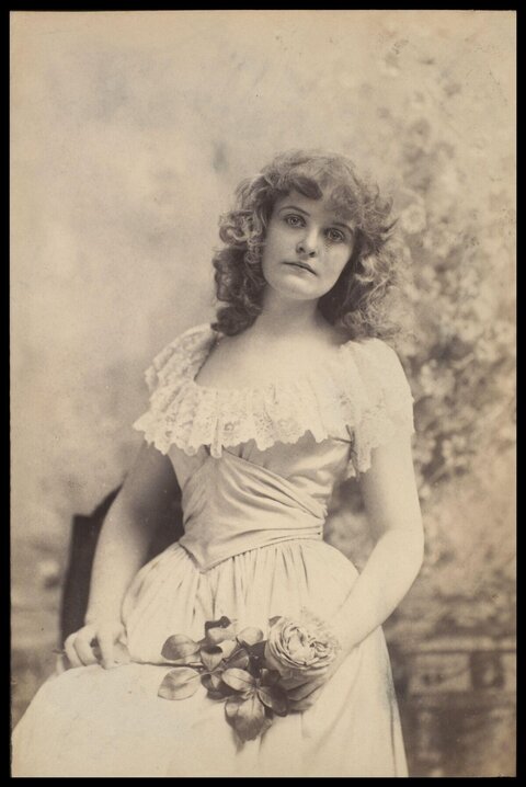 Vintage Portrait of Seated Woman with Rose