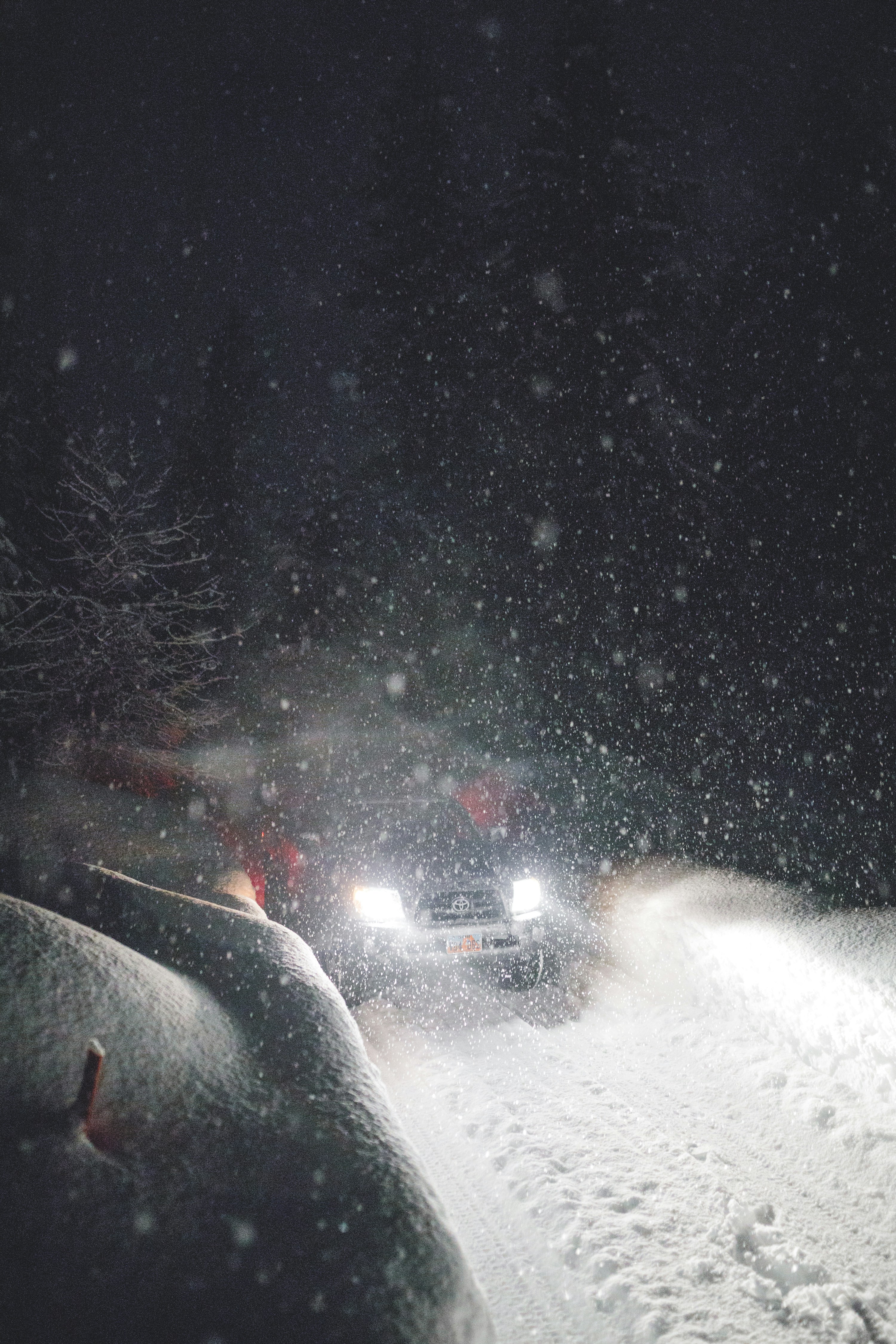 Off-road Vehicle on Night Snowy Road