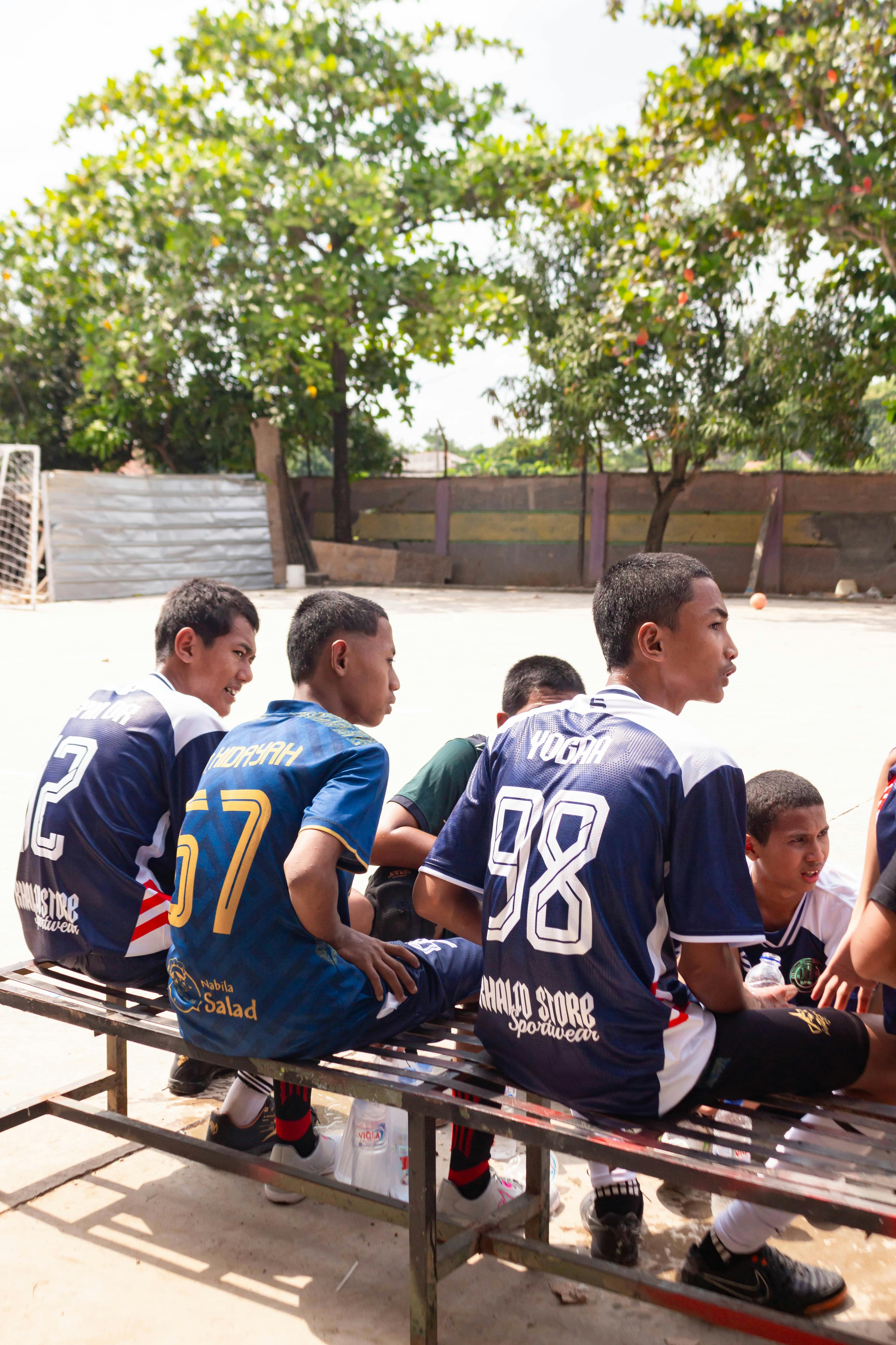 Young Soccer Players Waiting On Bench