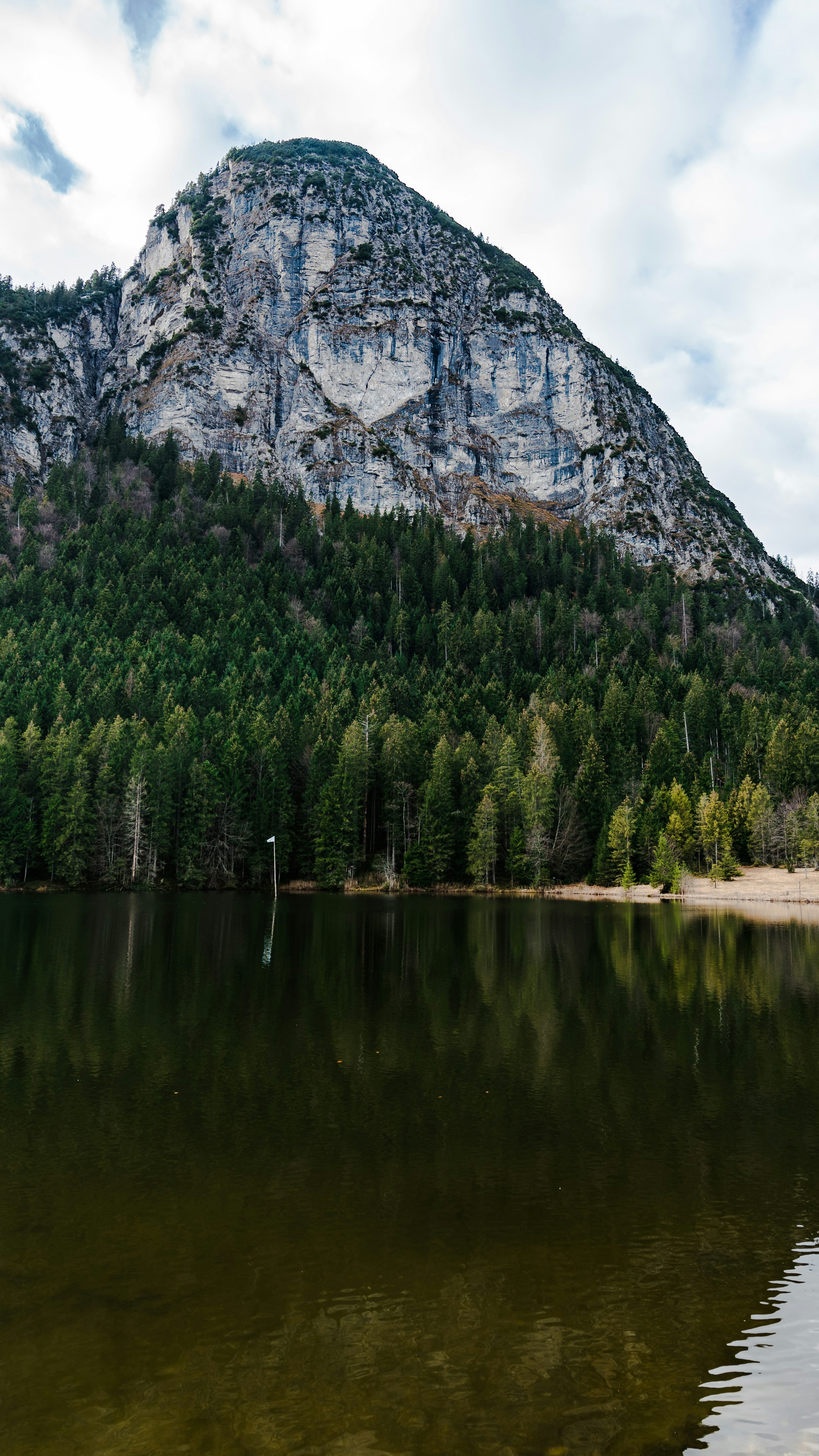 Rock Mountain By Calm Lake