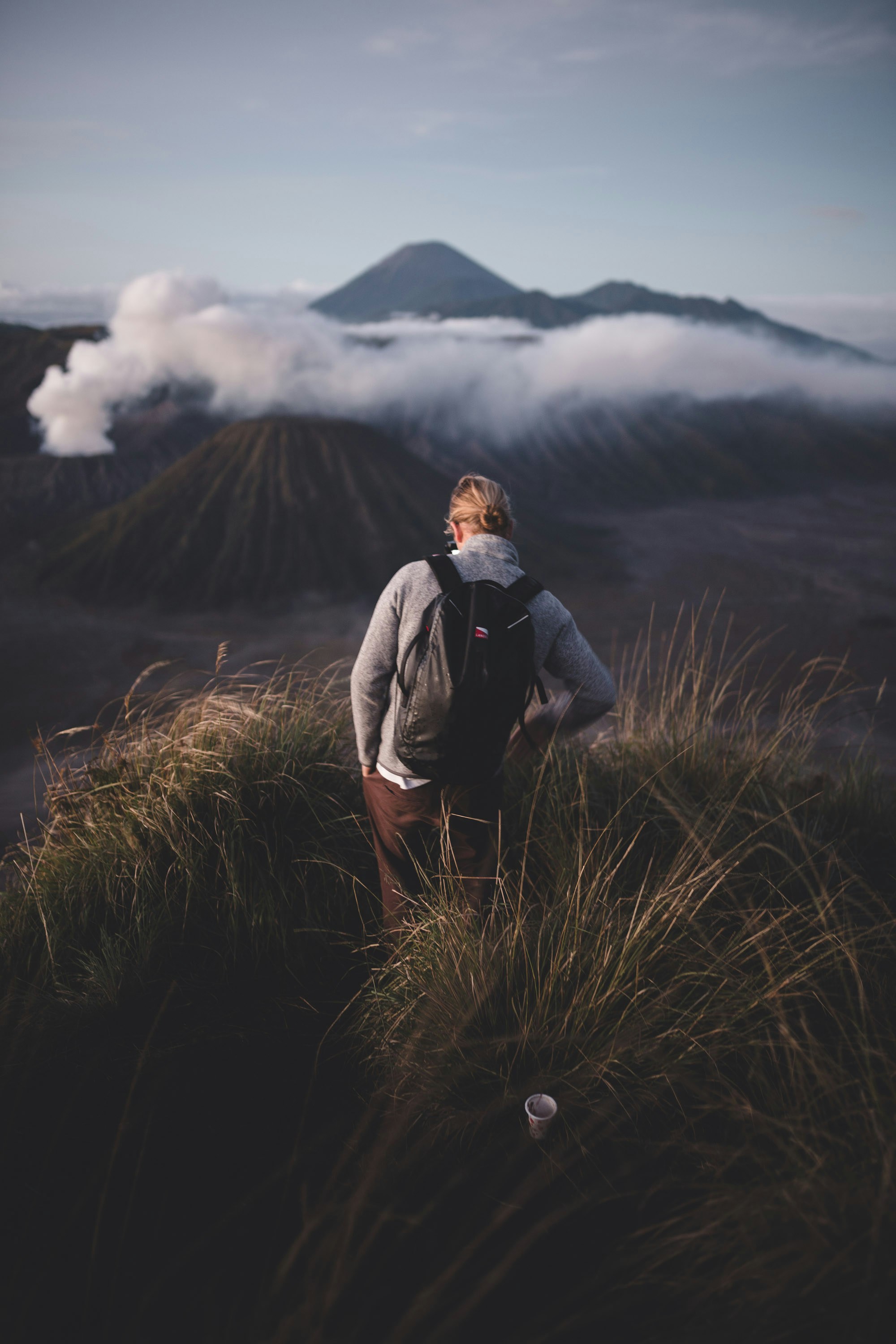 Hiker Overlooking Volcanic Mountains
