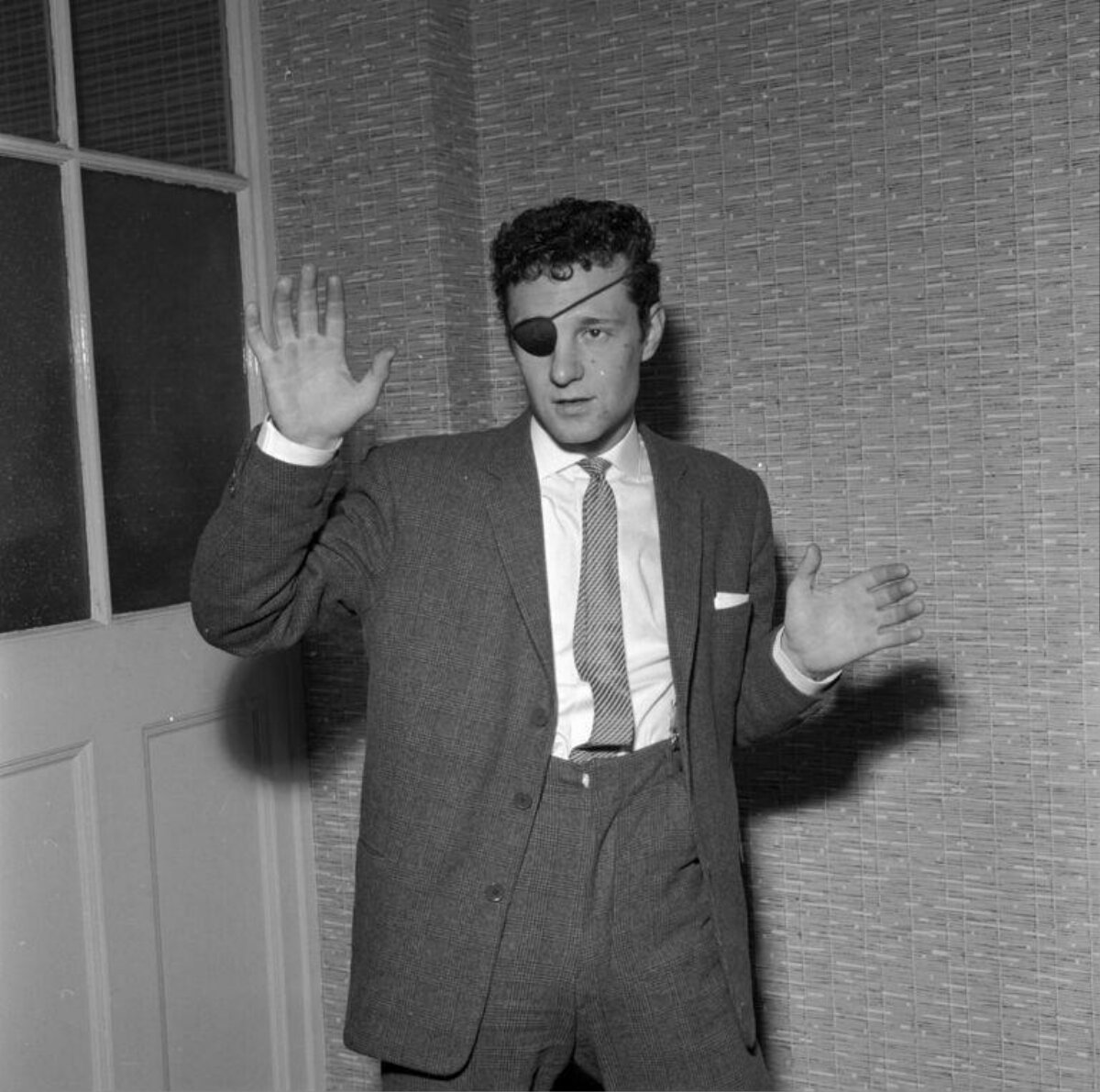 Man With Eye Patch In Formal Suit