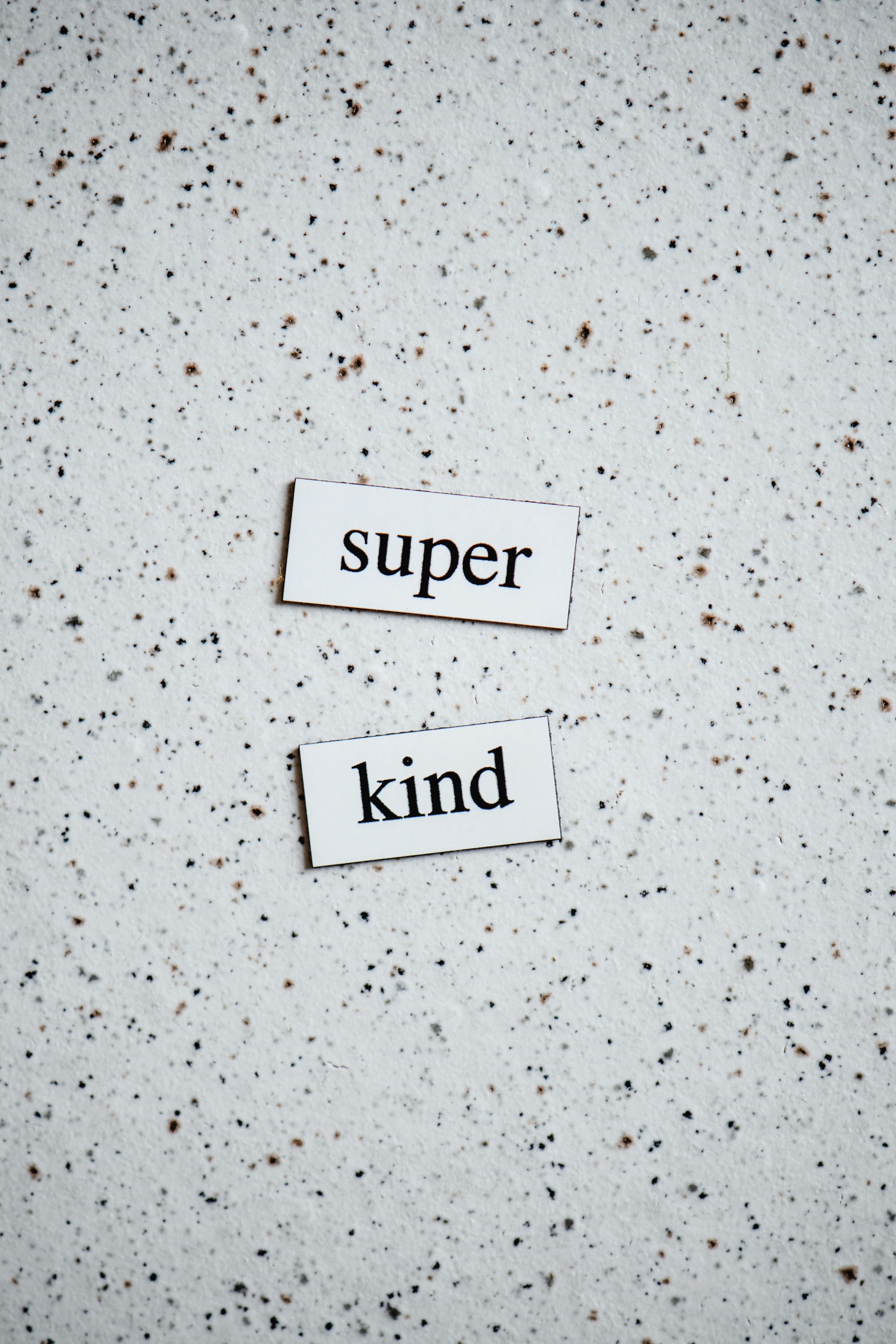 Super Kind Text on Speckled Background